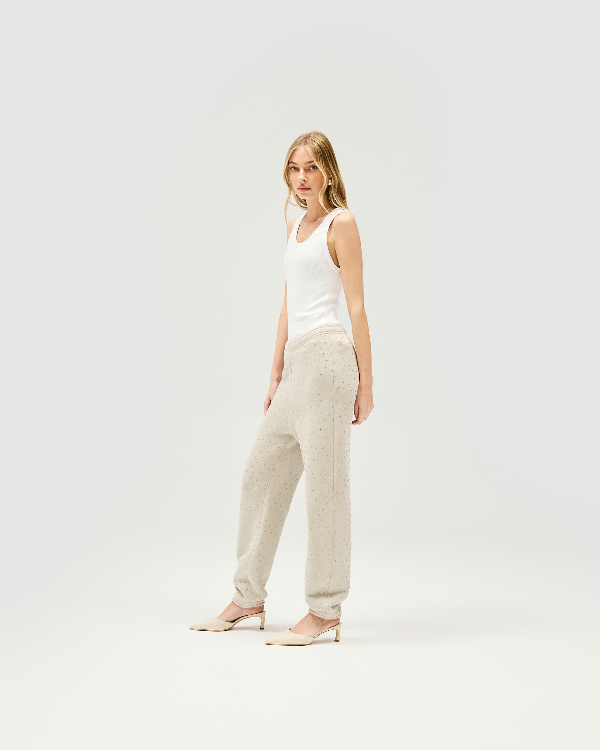 Back product image of womens grey trackpants on a plain white background | Spark Trackpant in Storm | Relaxed oversized fit jogger style trackpants | Womens SS25 Bottoms | Represent Clo