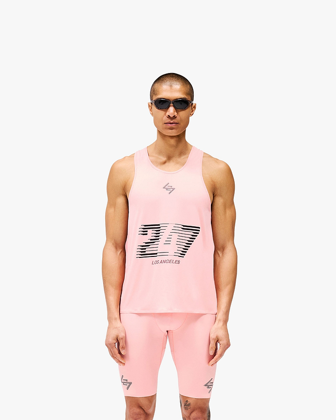 Man wearing a pink singlet on a plain white background | 247 Los Angeles Singlet in Pink | Lightweight breathable racerback singlet with mesh back | 247 T-Shirts | Represent Clo