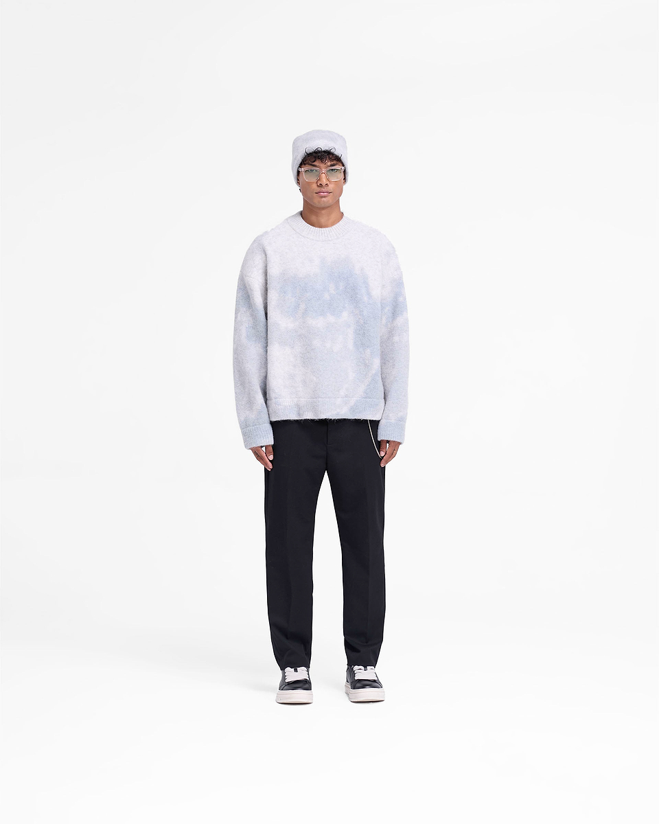 Man wearing an oversized grey knit sweater on a plain white background | Abstract Knit Sweater in Rock | Alpaca wool blend with ribbed cuffs | FW24 Knitwear | Represent Clo