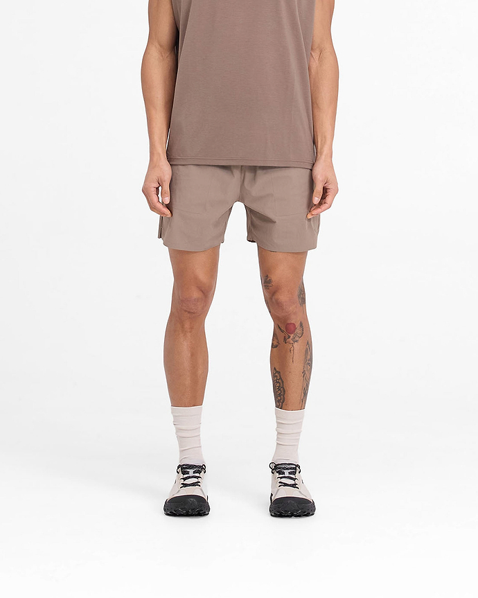 Man wearing mens umber shorts on a plain white background | Team 247 Fused Shorts in Umber | Shorts with branded waistband and 4-way stretch | 247 Shorts | Represent Clo