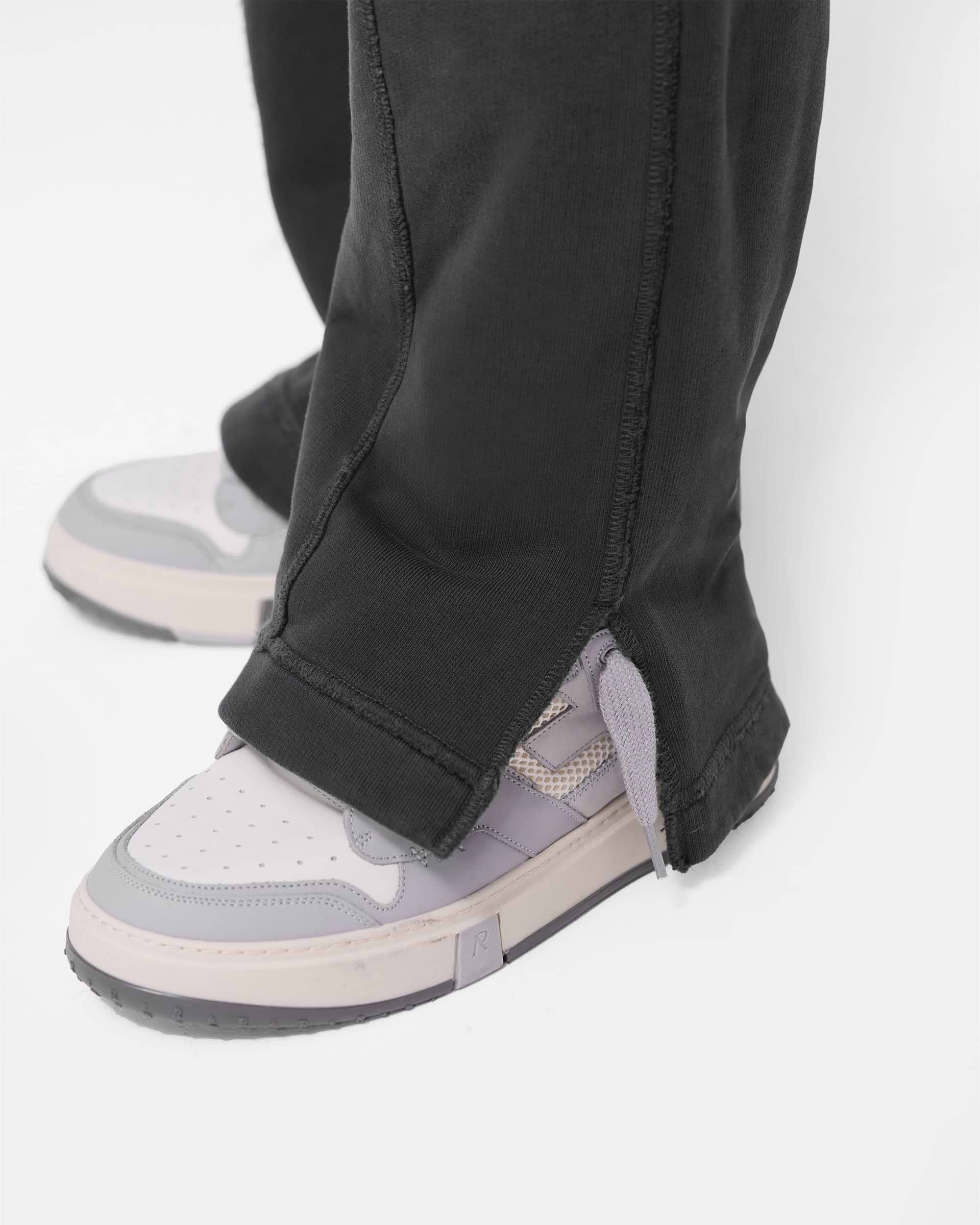 パンツ・ボトムスその他 Represent Washed black jogging pants Stepped Hem Sweatpants - Stained Black | REPRESENT