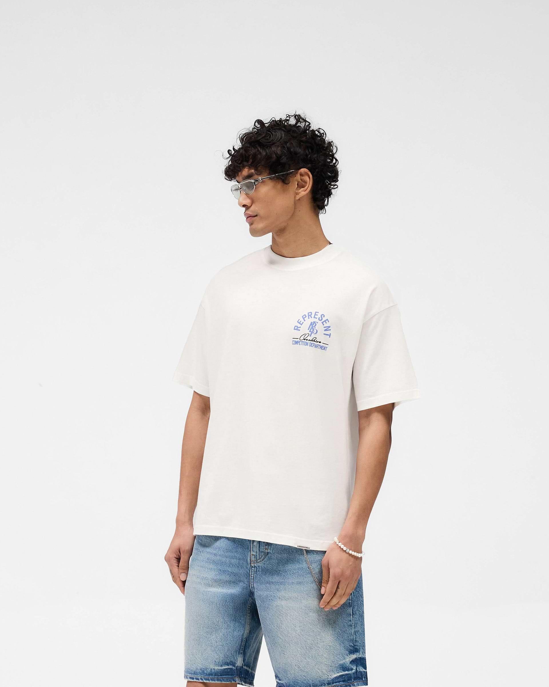 Back product image of a mens white t-shirt on a plain white background | Competition Department T-Shirt in Flat White | T-shirt with oversized fit and ribbed neckline | SS25 T-Shirts | Represent Clo