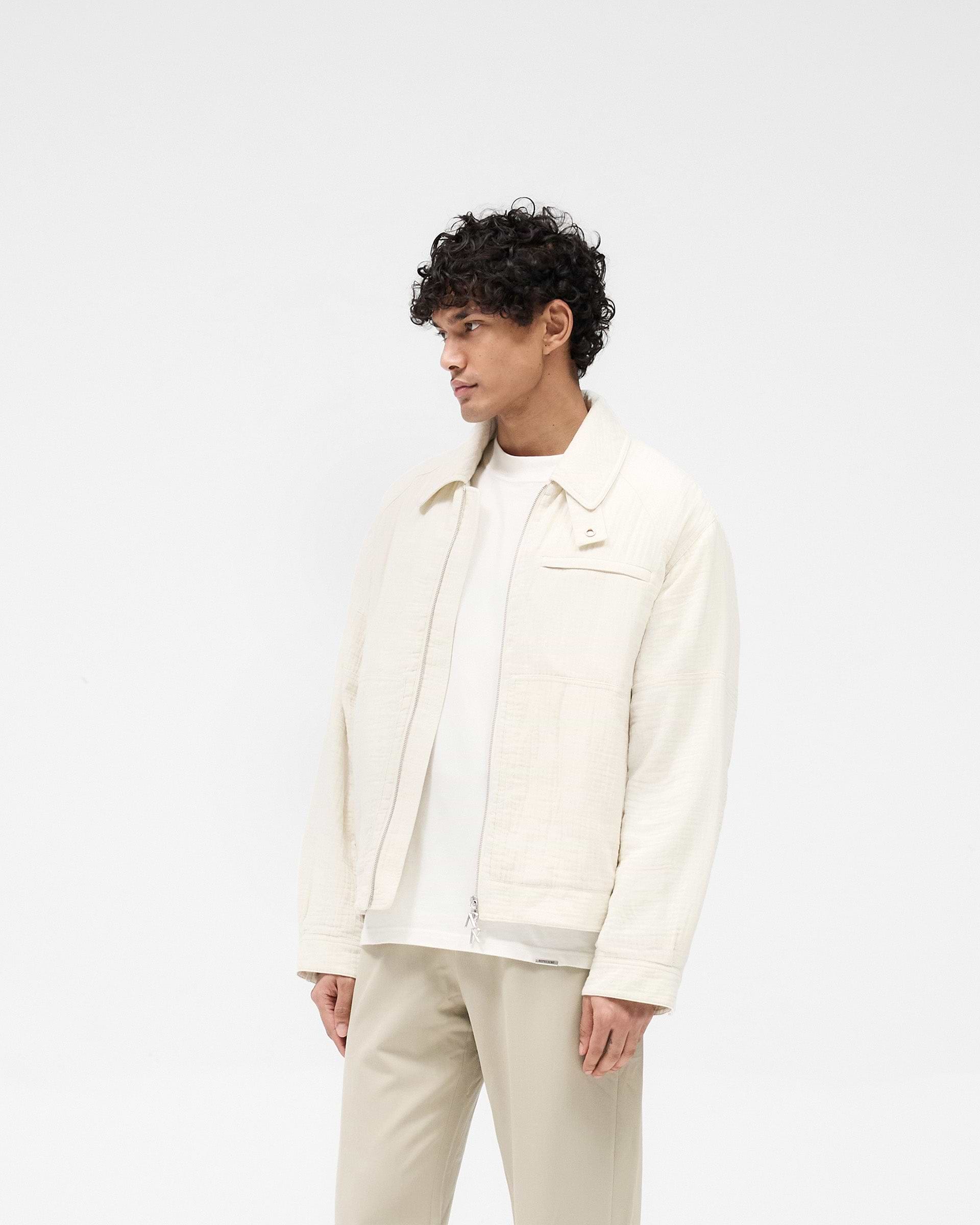 Back product image of a mens ecru jacket on a plain white background | Crinkle Trucker Jacket in Ecru | Jacket with oversized fit and textured finish | SS25 Outerwear | Represent Clo