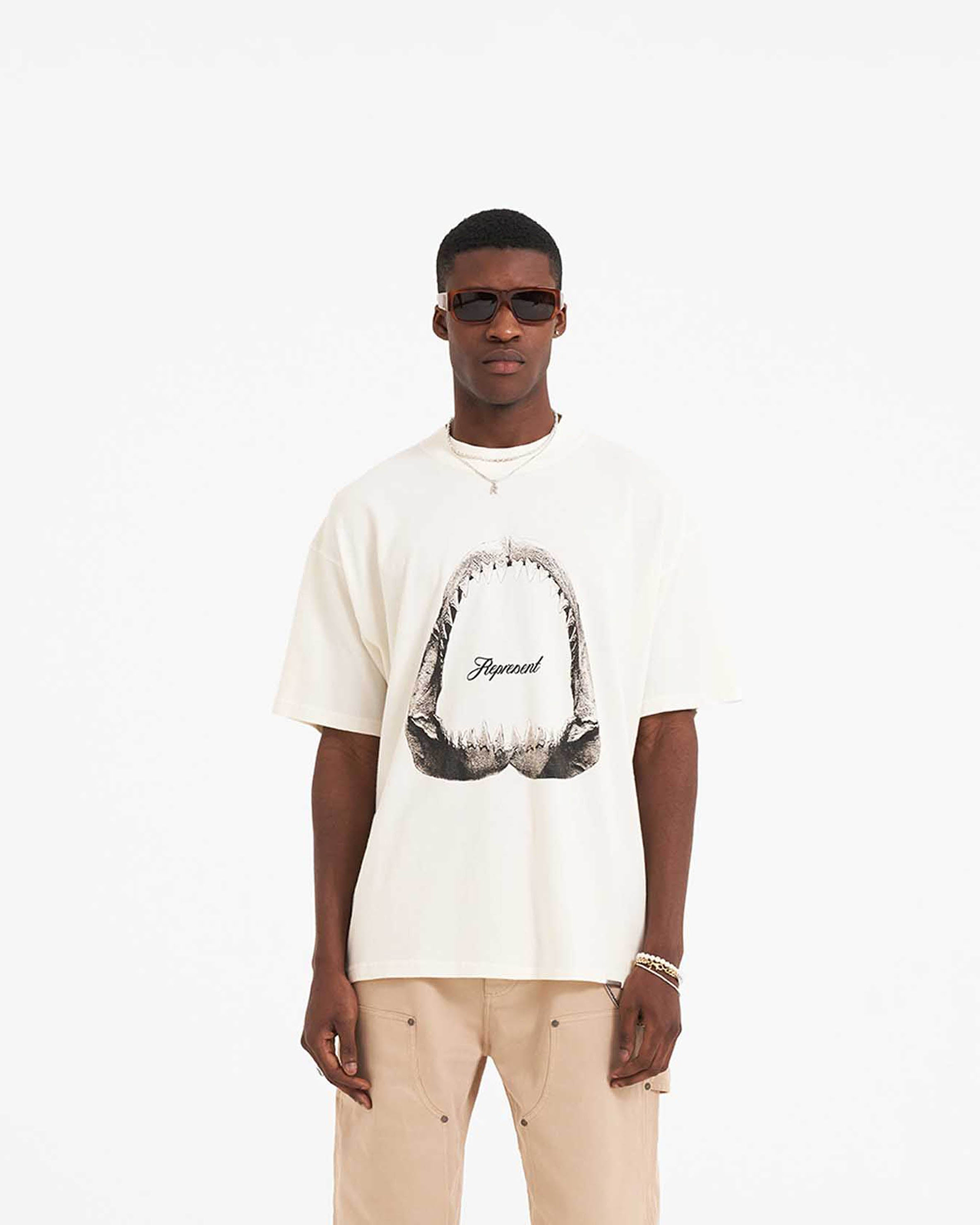 Back product image of a mens white graphic t-shirt on a plain white background | Shark Jaws T-Shirt in Flat White | Oversized short sleeve t-shirt with ribbed crewneck | SS23 T-Shirts | Represent Clo