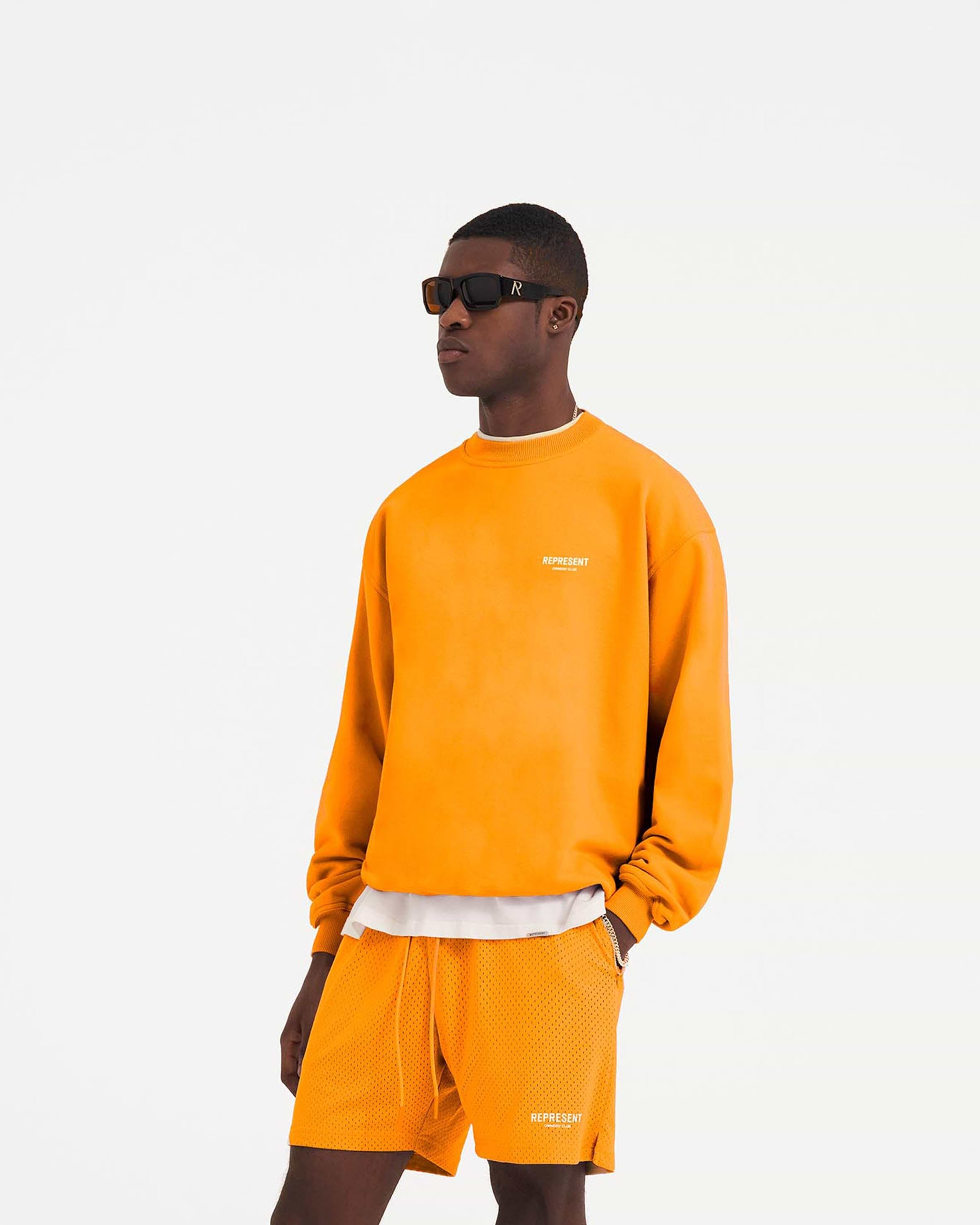 Bright orange shop sweater