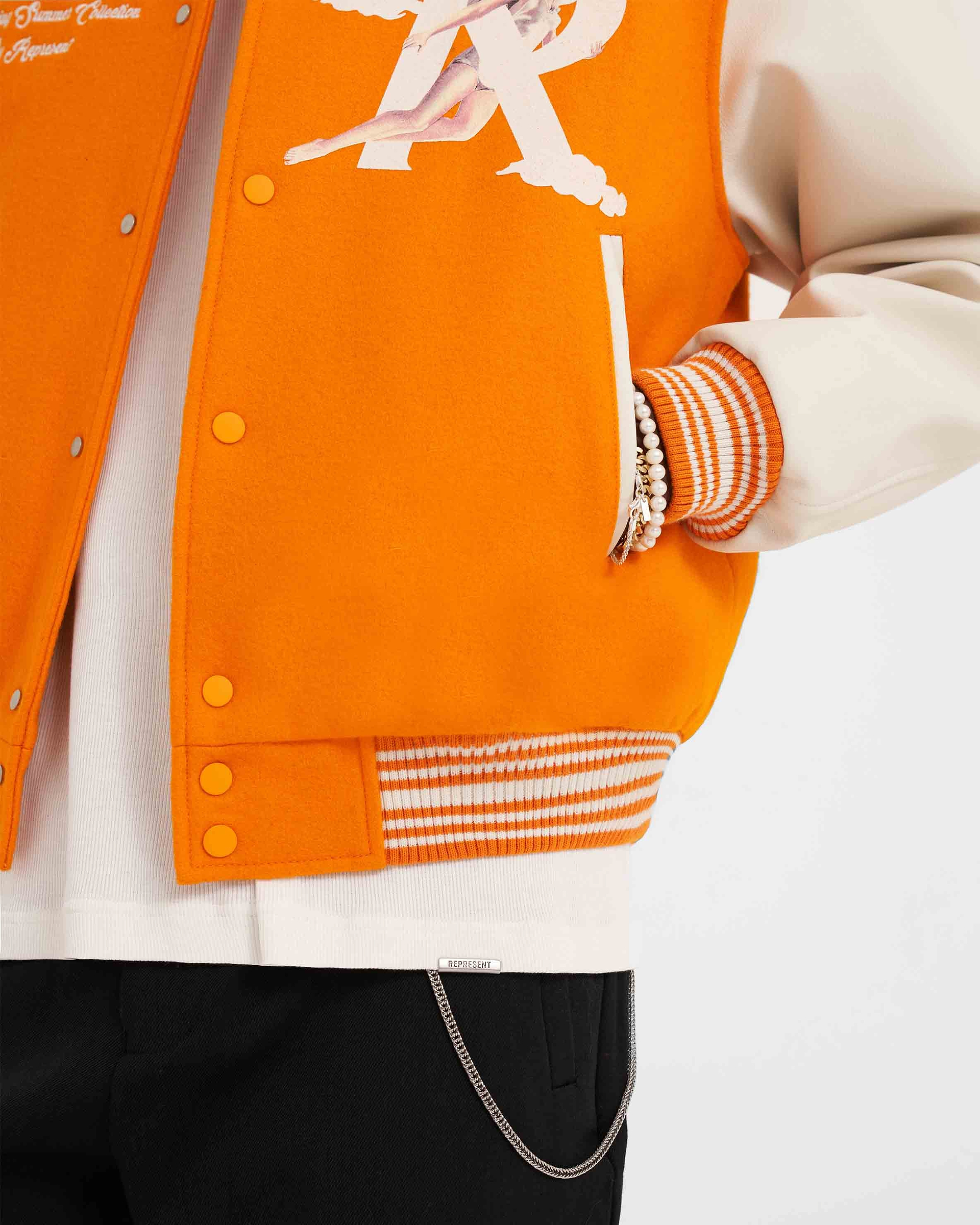 Represent Orange Storms In Heaven Varsity Jacket