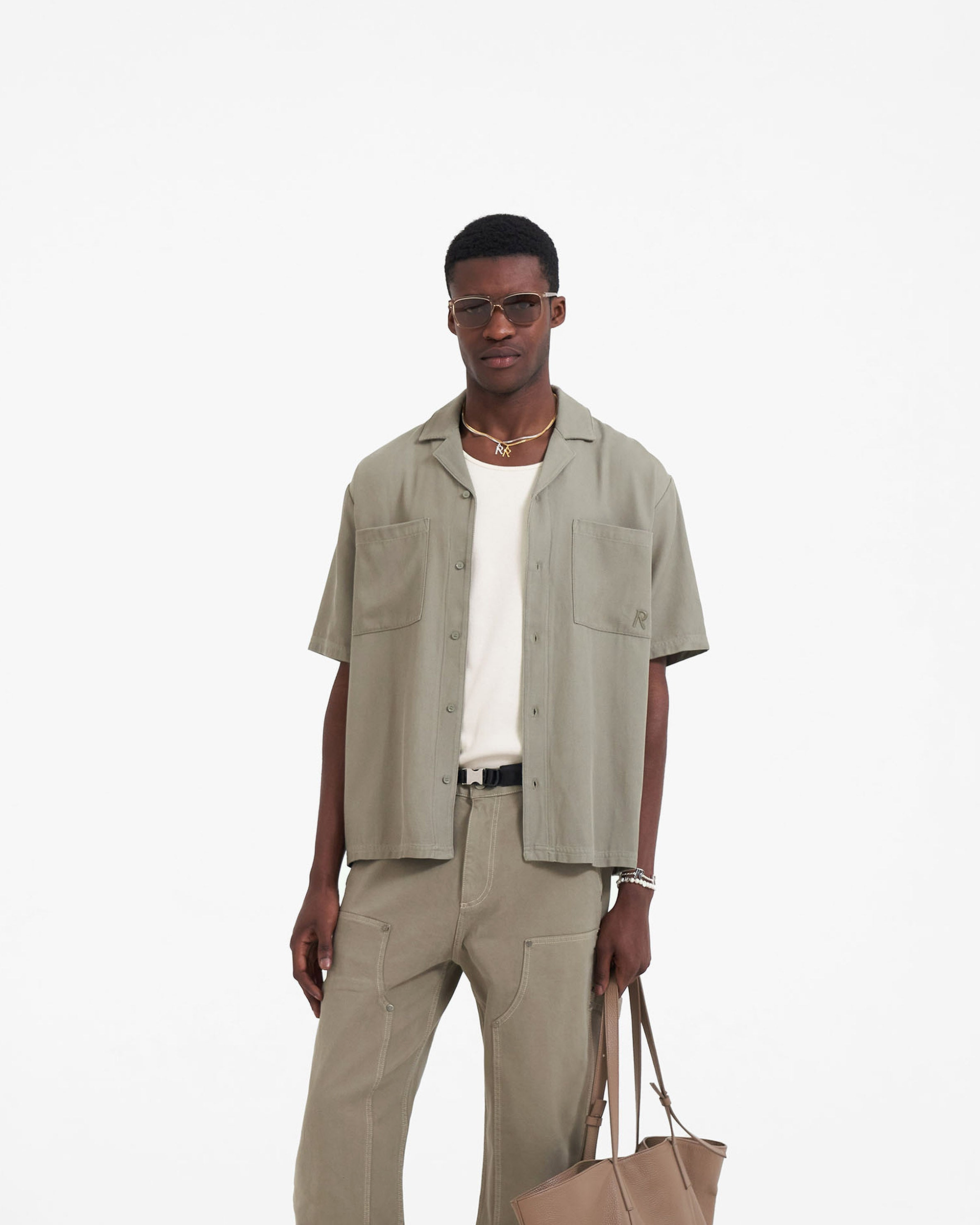 Back product image of a mens khaki shirt on a plain white background | Yacht Shirt in Khaki | Oversized shirt with cuban collar and chest pockets | SC23 Shirts | Represent Clo