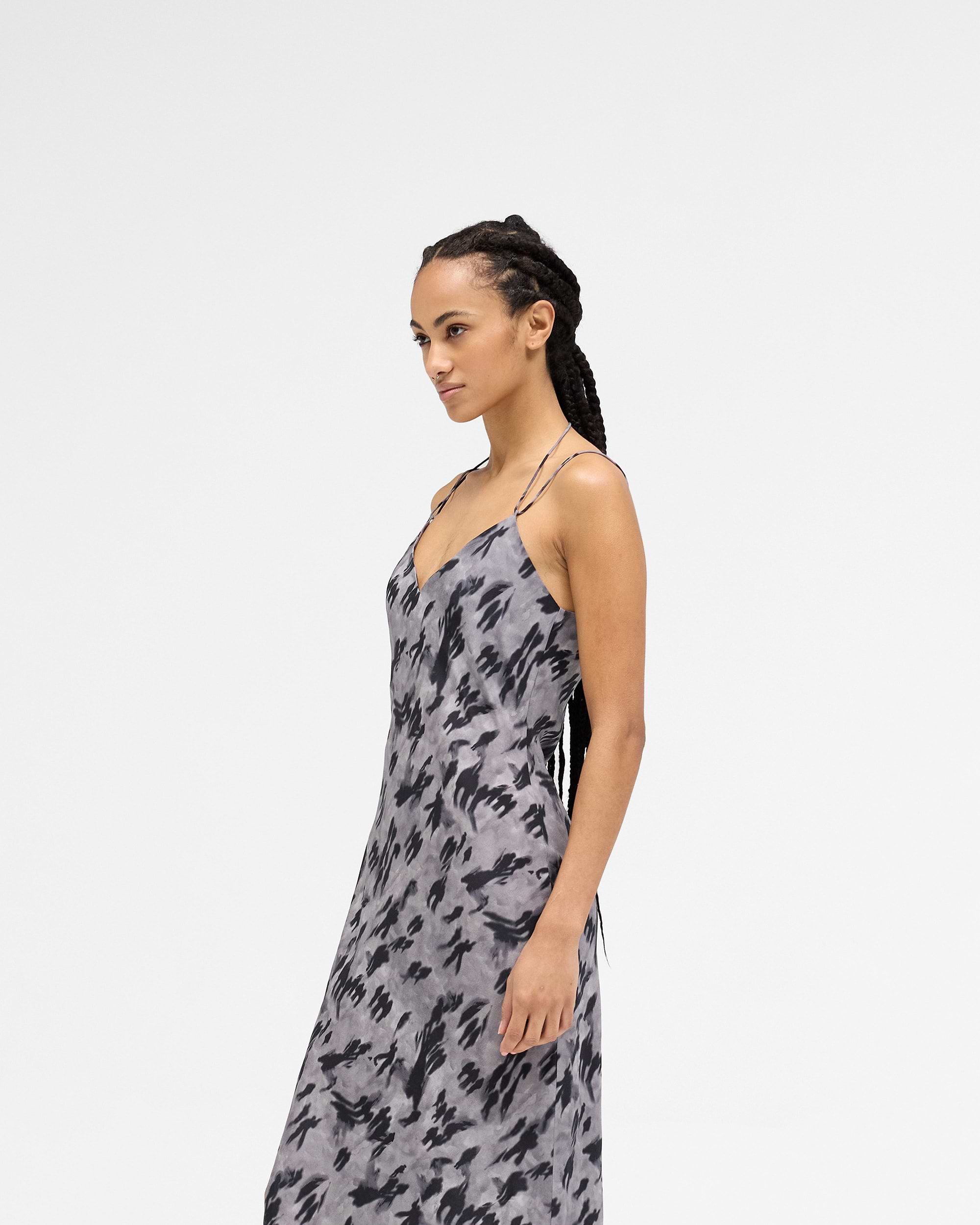 Back product image of a womens dark print dress on a plain white background | Street Shadow Dress in Dark Scenic Print | Slip dress with adjustable straps and thigh split | Womens SS25 Dresses | Represent Clo
