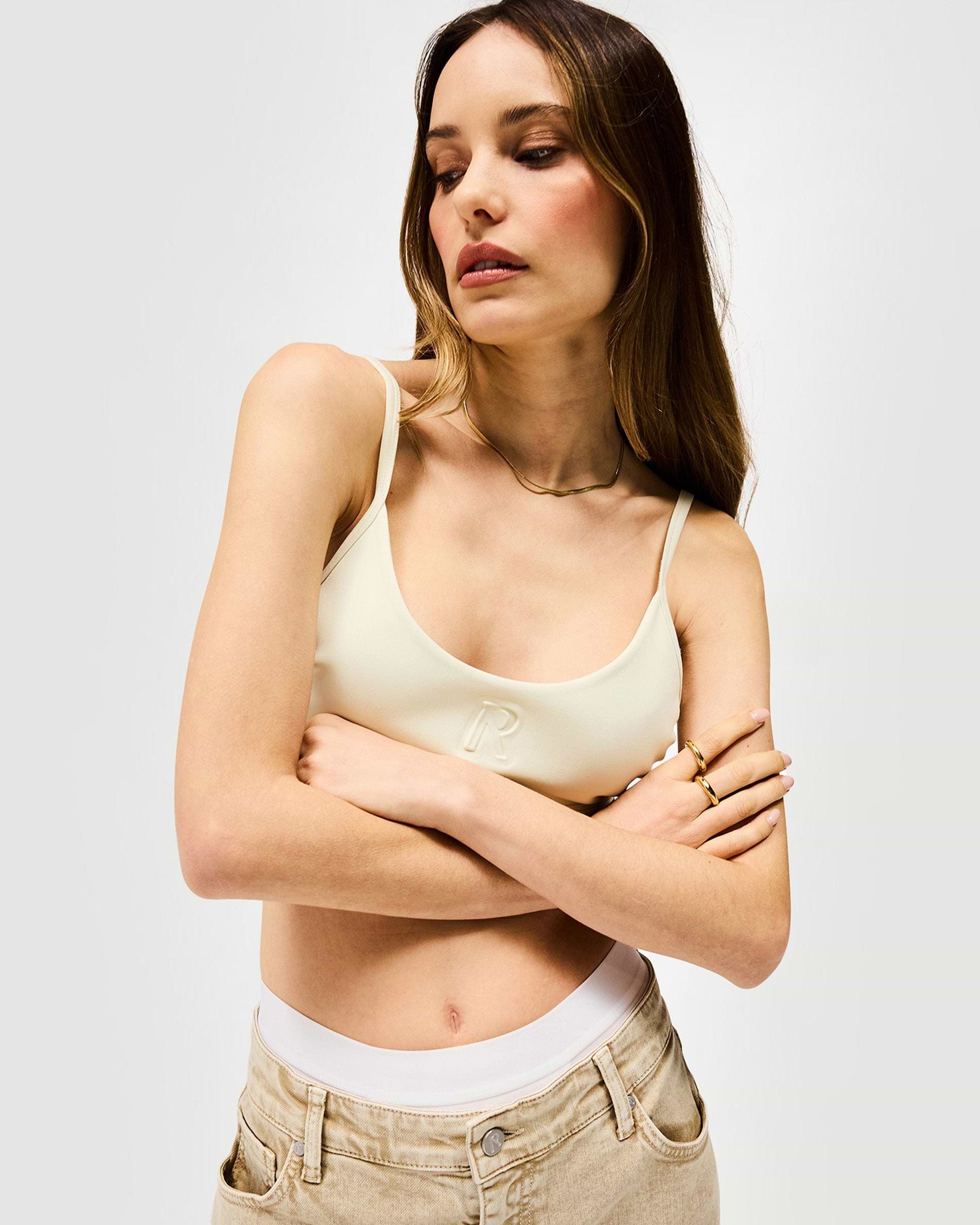 Back product image of a womens white bralette on a plain white background | Control Bralette in Warm White | Bralette top with adjustable fit and Initial R detail | SS25 Tops | Represent Clo
