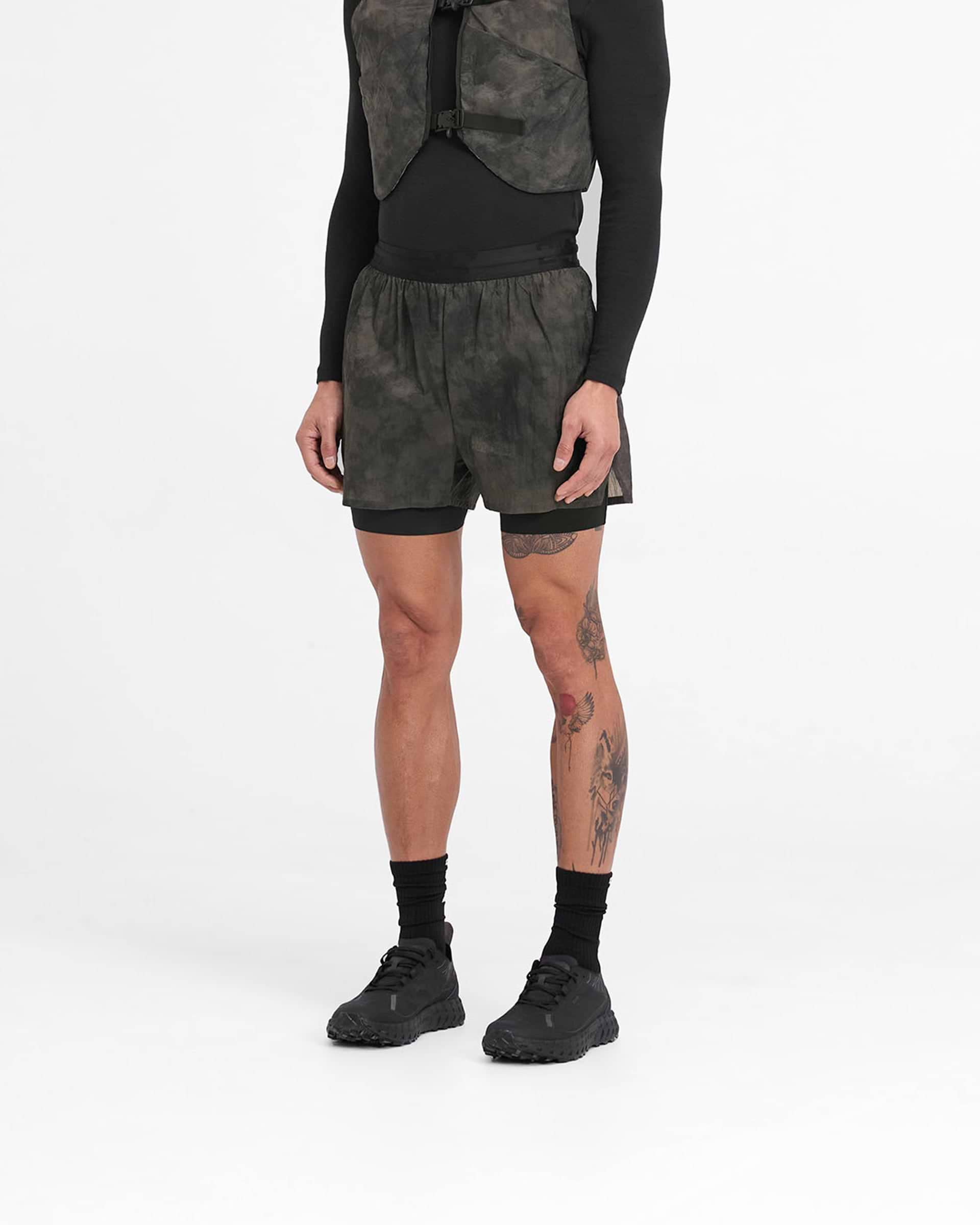 Man wearing terrain coloured 2-in-1 trail shorts on a plain white background | 247 Trail Short in Terrain | Nylon outer with internal tight and zip pockets | 247 Shorts | Represent Clo