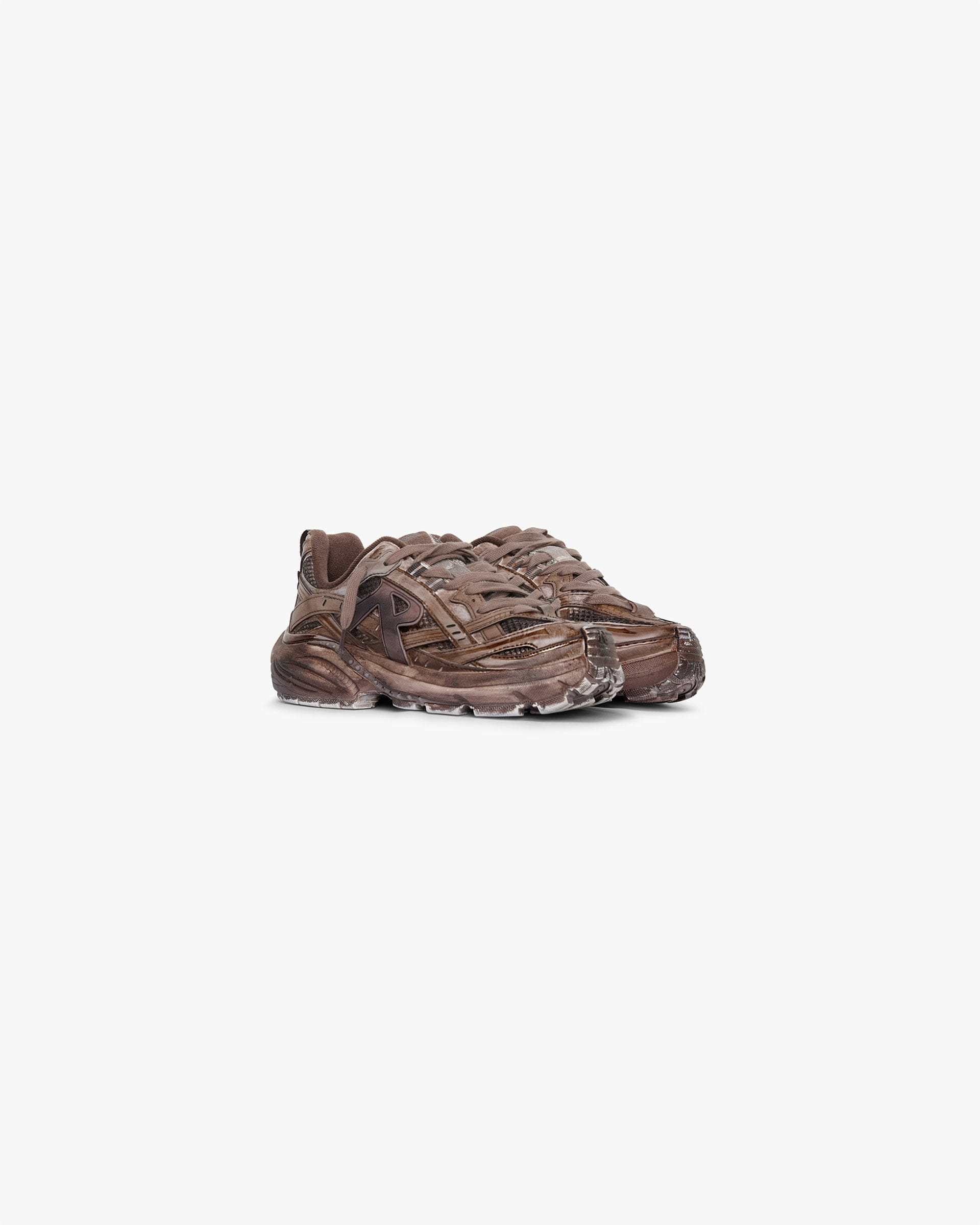Back product image of a womens brown shoe on a plain white background | Storm Runner in Dip Dye Chocolate | Lightweight open sandwich mesh upper with synthetic overlays | Womens SS25 Footwear | Represent Clo