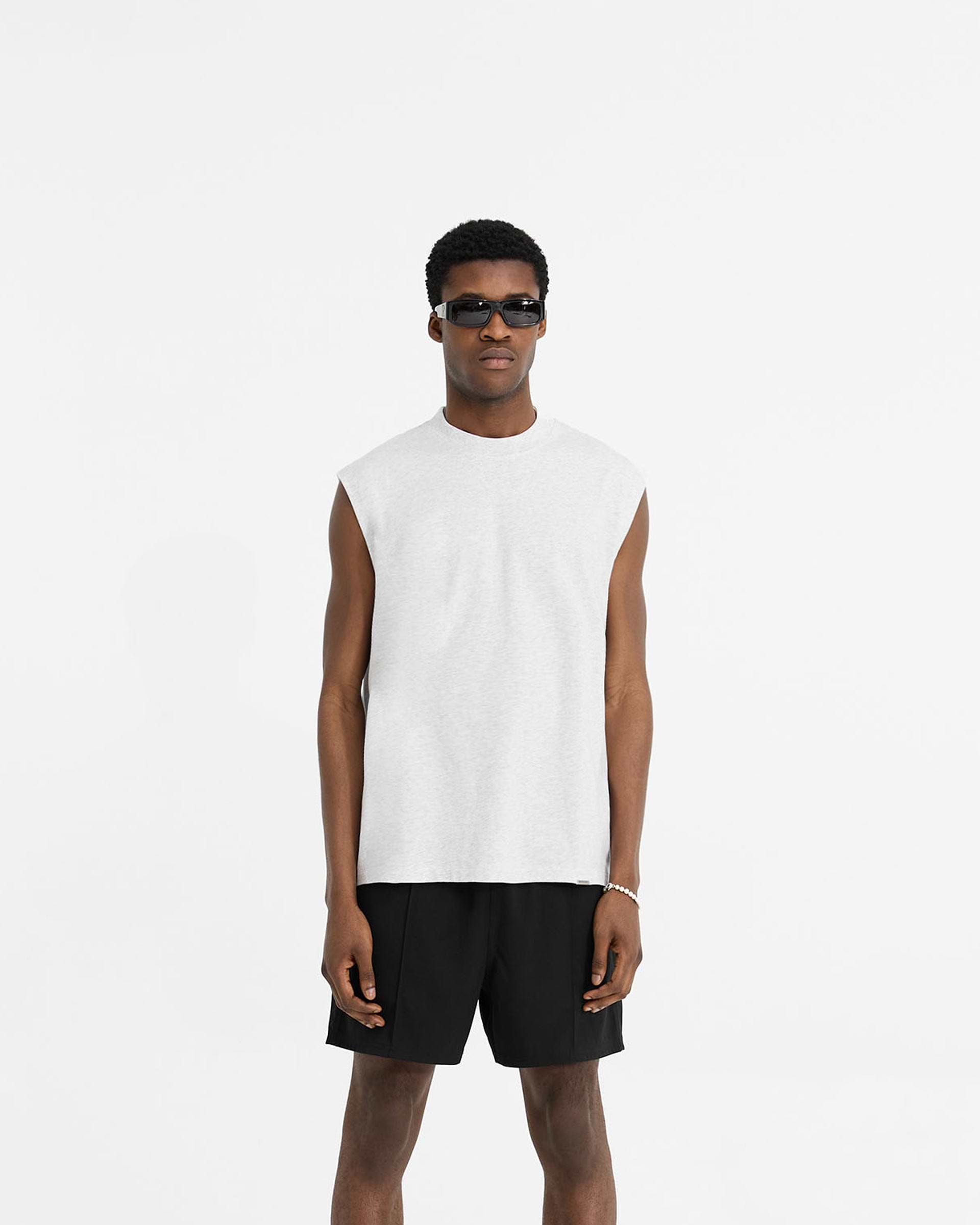 Man wearing a grey tank top on a plain white background | Initial Boxy Tank in Ice Grey Marl | Oversized tank with boxy cropped fit | Initial T-Shirts | Represent Clo