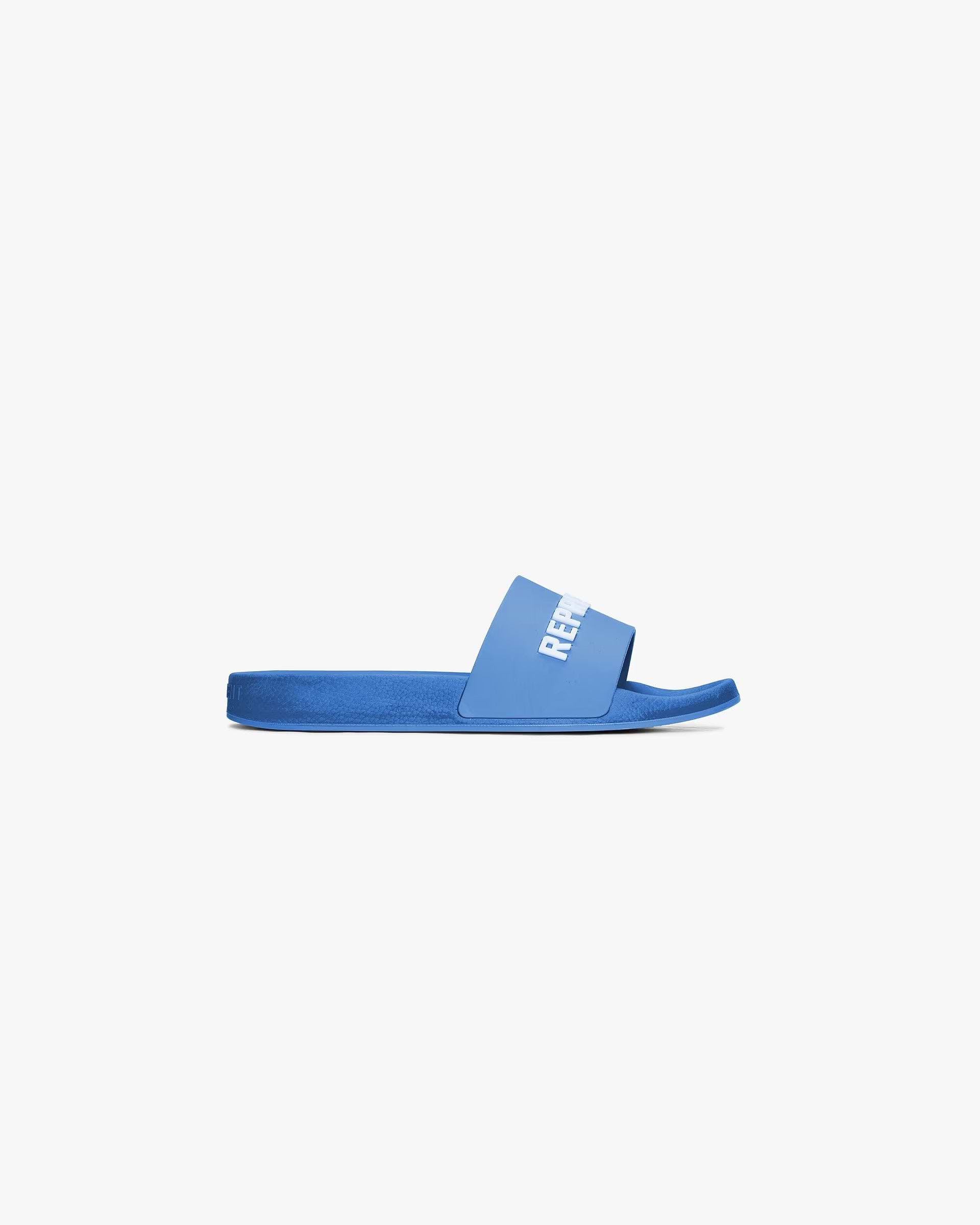 Front product image of mens blue pool slide on a plain white background | Represent Pool Slide in Cobalt | Comfortable slide footwear with Represent branding | SC24 Footwear | Represent Clo