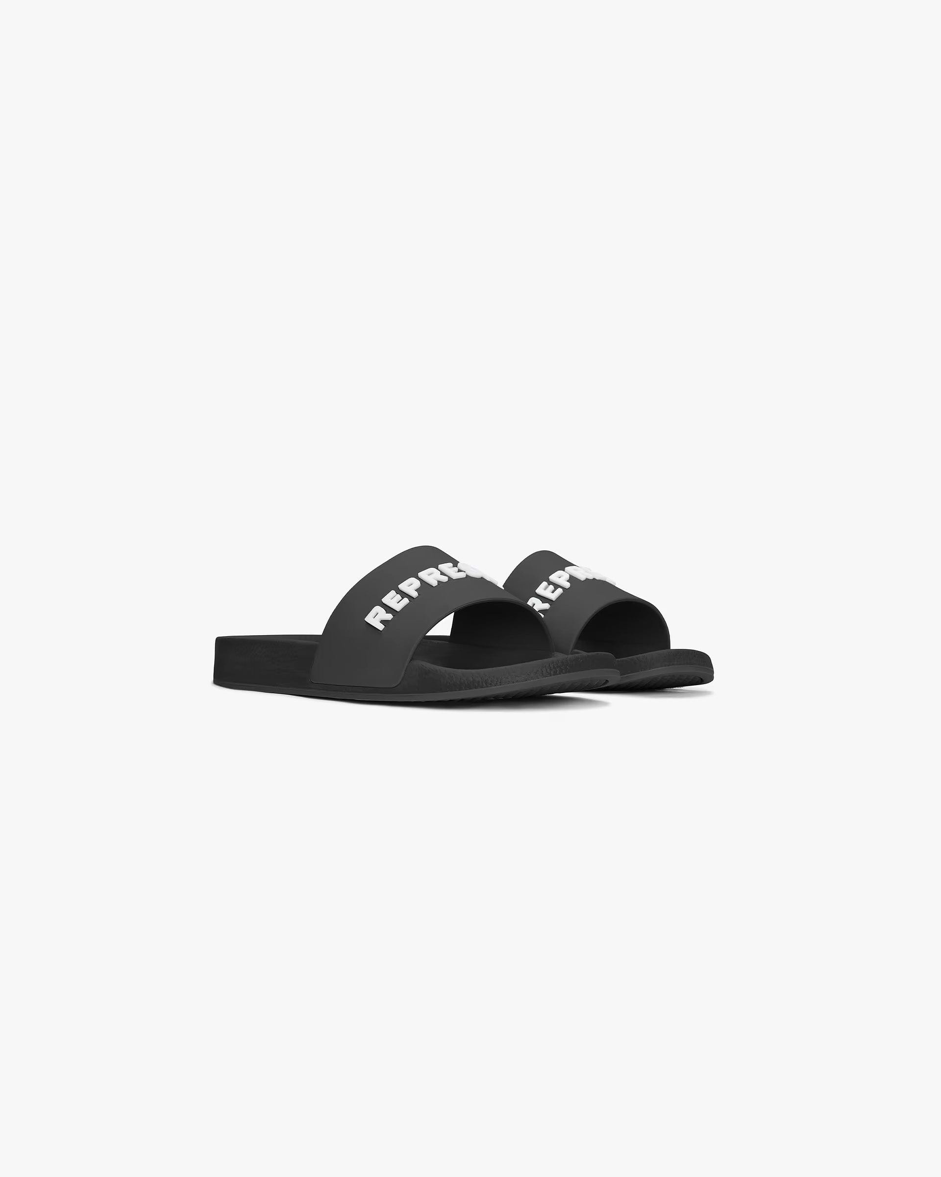 Back product image of mens black slides on a plain white background | Represent Pool Slide in Black | Slides with raised rubber logo | SC24 Footwear | Represent Clo