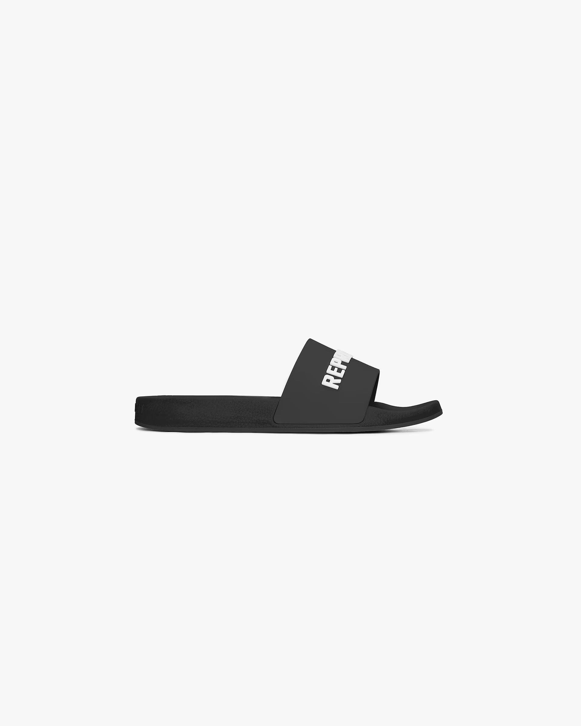 Front product image of a mens black pool slide on a plain white background | Represent Pool Slide in Black | Comfortable slip-on footwear with cushioned sole | SC24 Footwear | Represent Clo