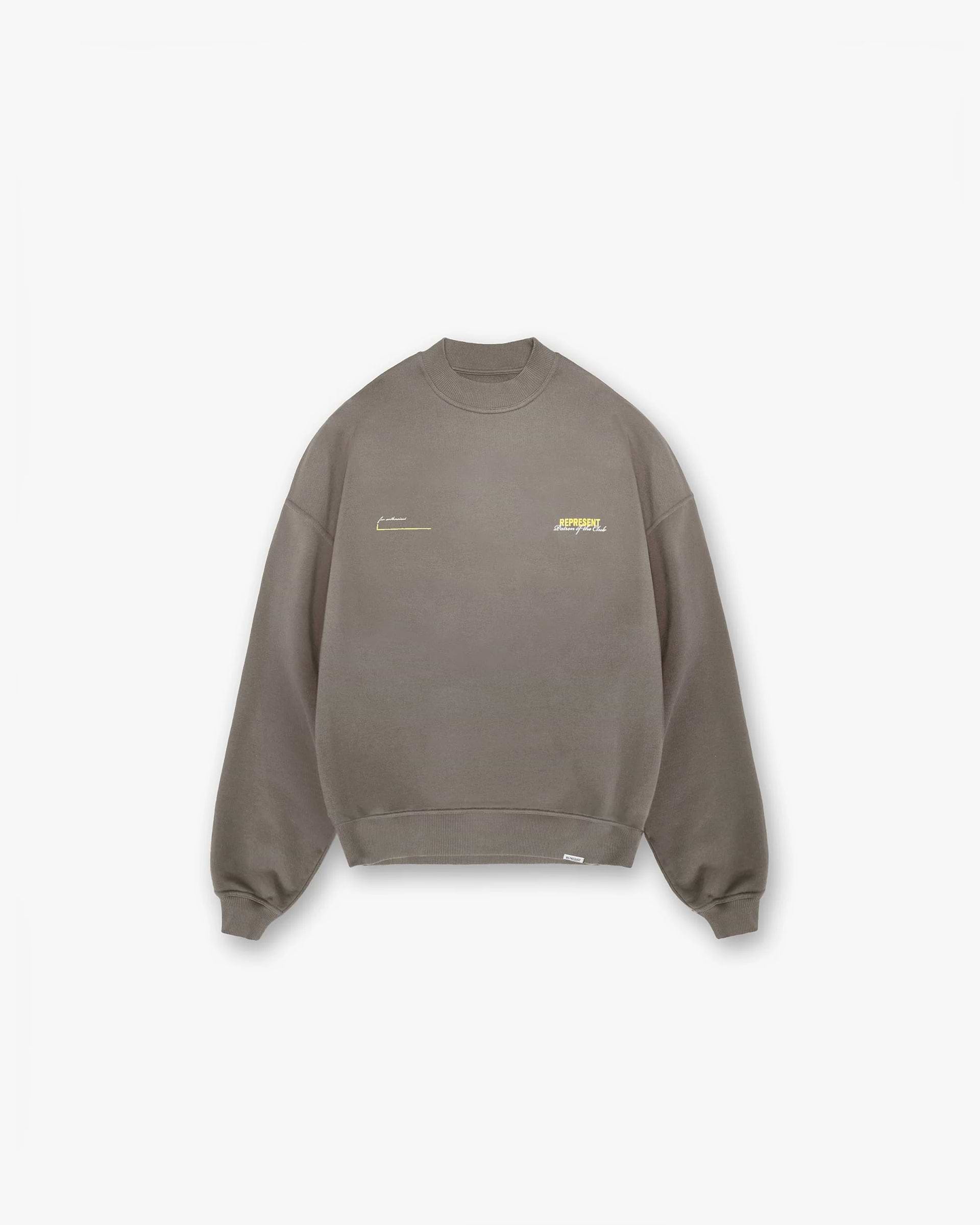Front product image of a mens green sweater on a plain white background | Patron Of The Club Sweater in Washed Olive | Medium weight cotton sweater with logo | Patrons Sweaters | Represent Clo