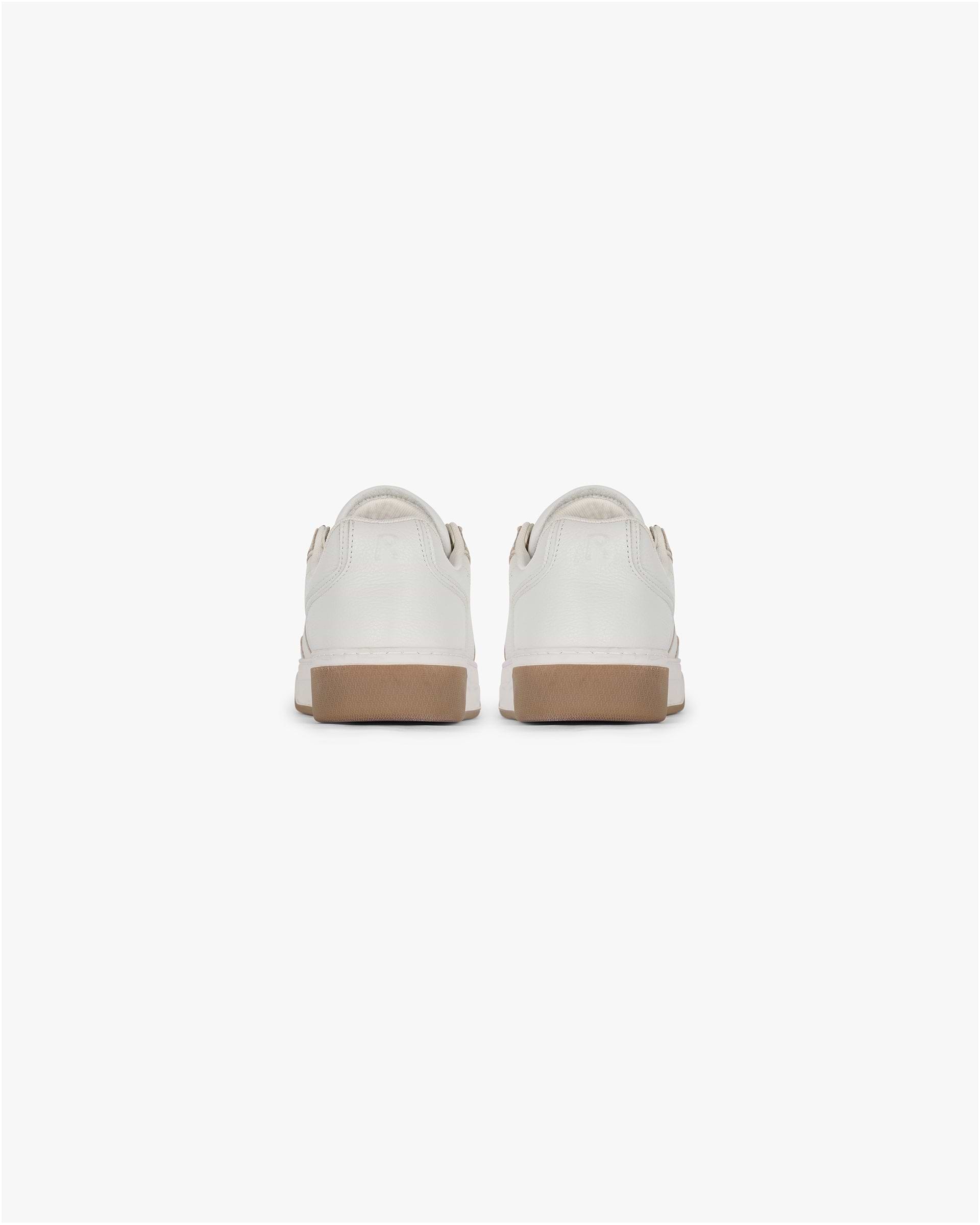 Product image of a mens white leather sneaker on a plain white background | Initial Sneaker in Vintage White Gum | Leather sneaker with perforated toe detailing | SS25 Footwear | Represent Clo