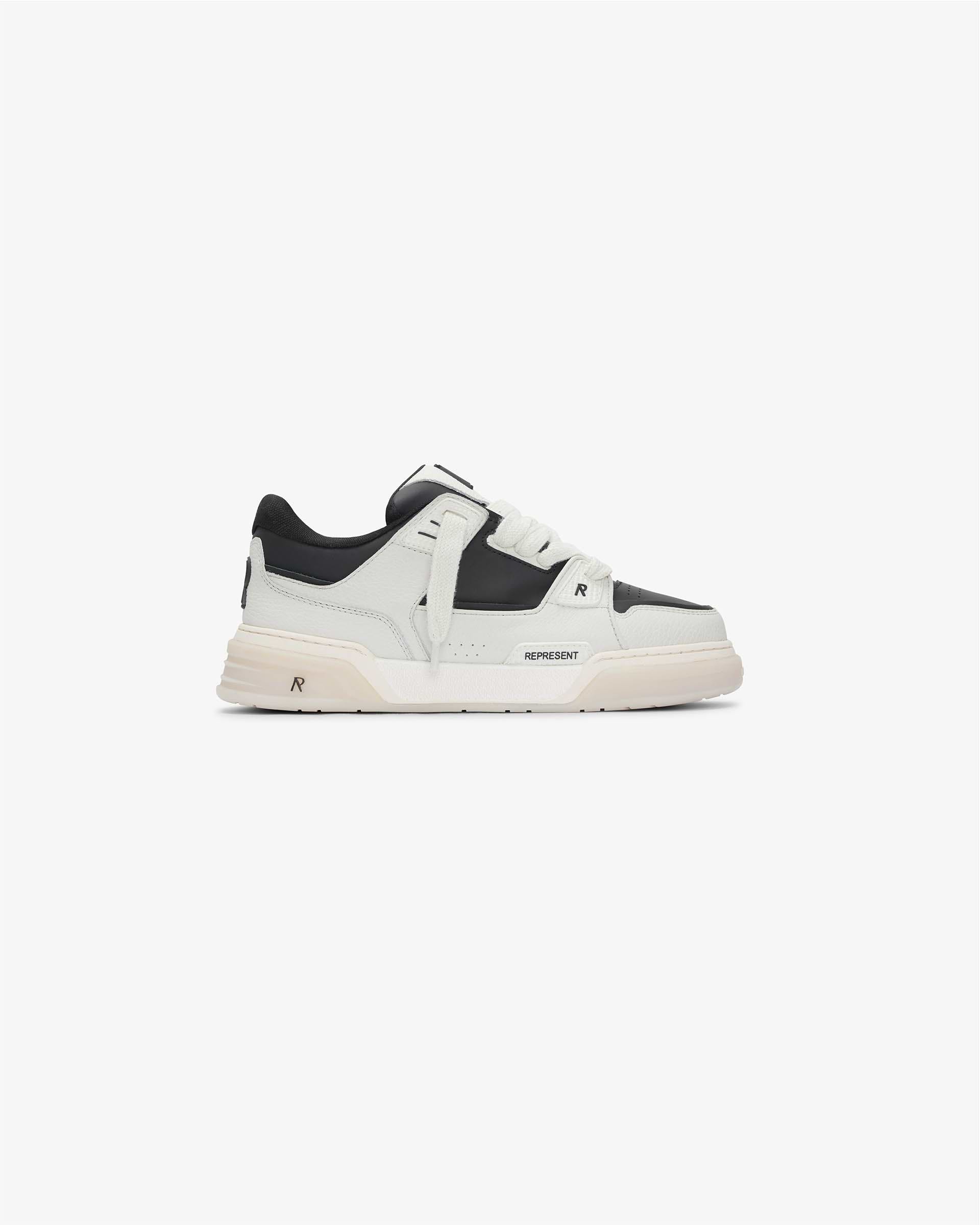 Front product image of mens white sneakers on a plain white background | Studio Sneaker in Vintage White Black | Footwear with vintage design | SS24 Footwear | Represent Clo