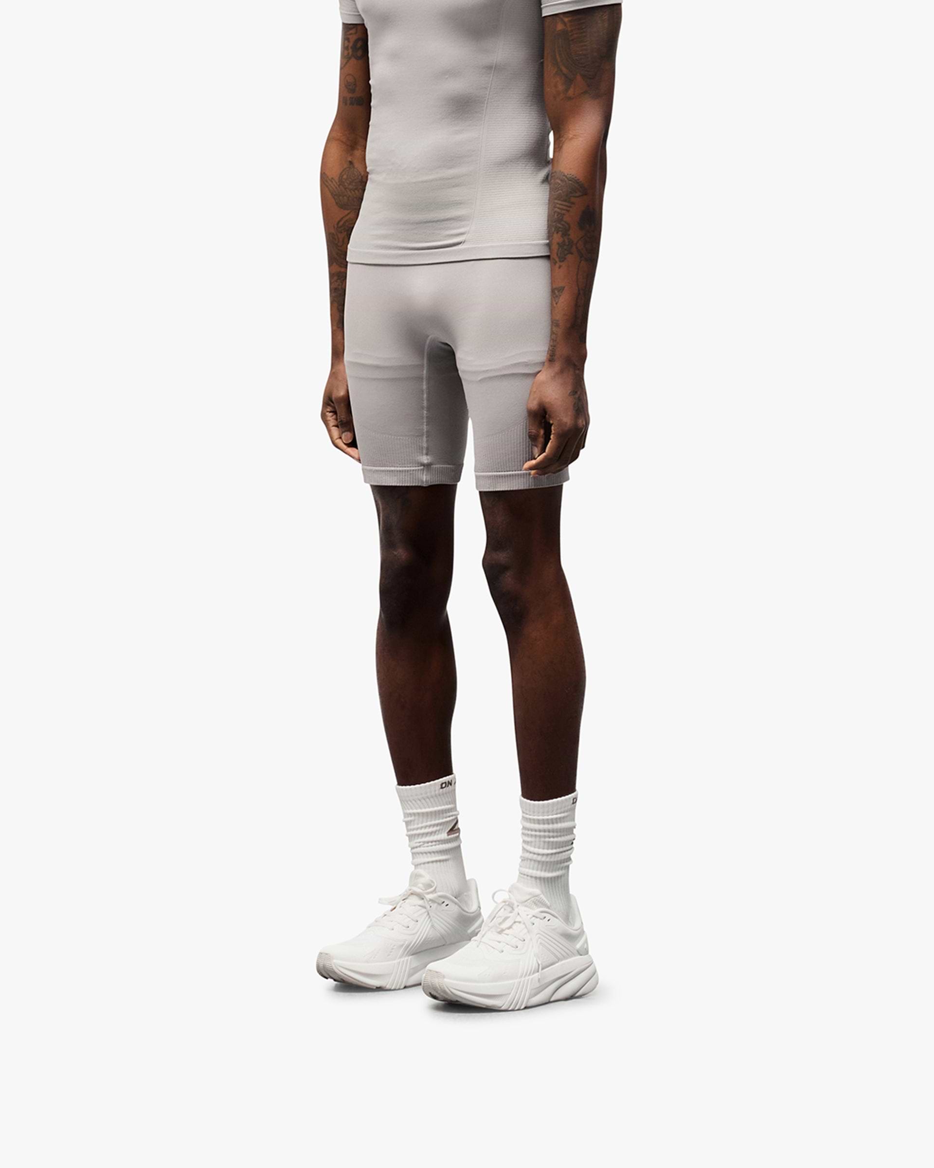 Back product image of mens grey shorts on a plain white background | 247 DNA Seamless Shorts in Titanium | Seamless shorts with flatlock stitching and compression support | 247 Shorts | Represent Clo
