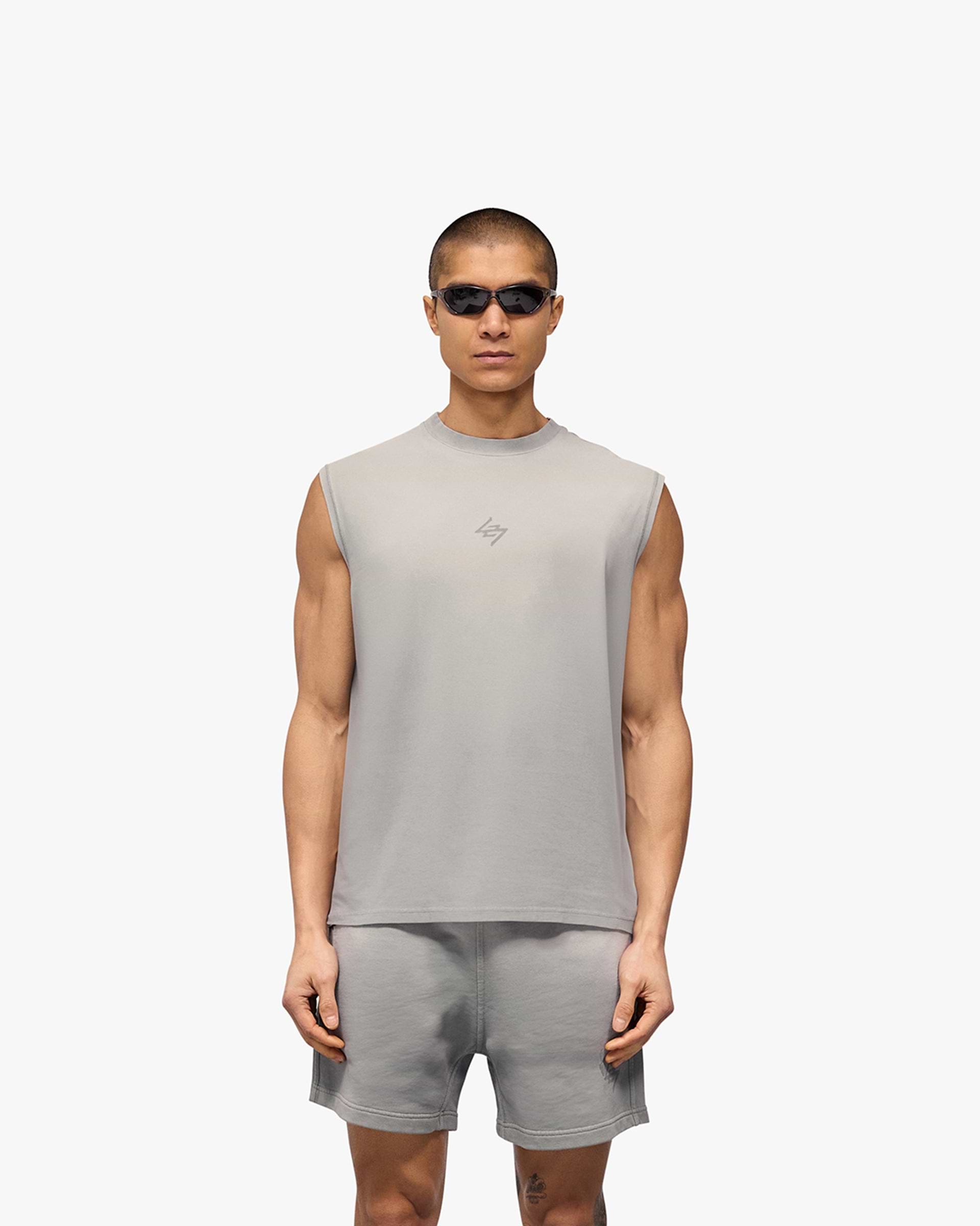 Man wearing a grey oversized tank on a plain white background | 247 Motion Oversized Tank in Titanium | Oversized tank with 2 way stretch and graphic print | 247 T-Shirts | Represent Clo