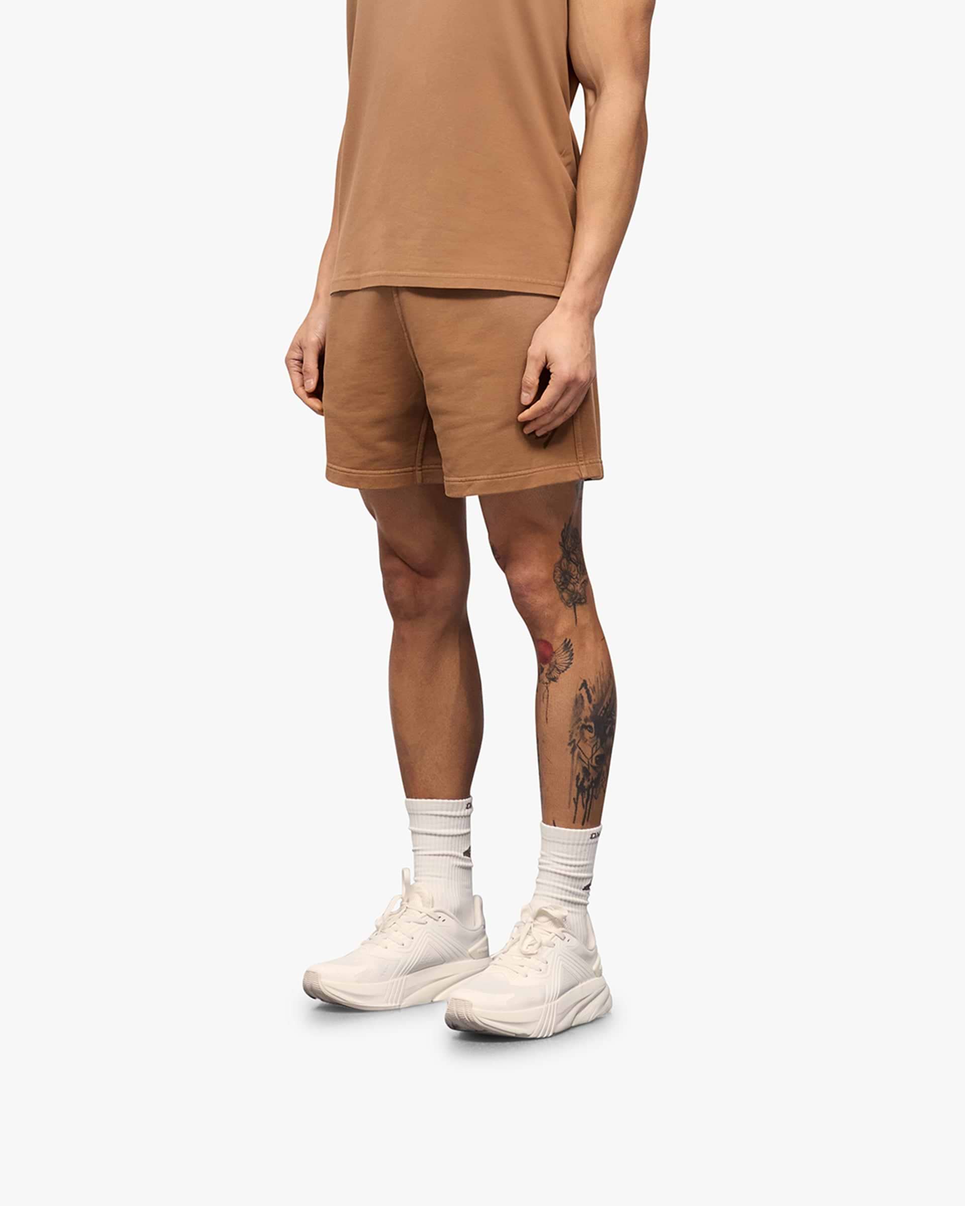 Back product image of mens rust shorts on a plain white background | 247 Motion Shorts in Rust | Jersey shorts with elasticated waistband | 247 Shorts | Represent Clo