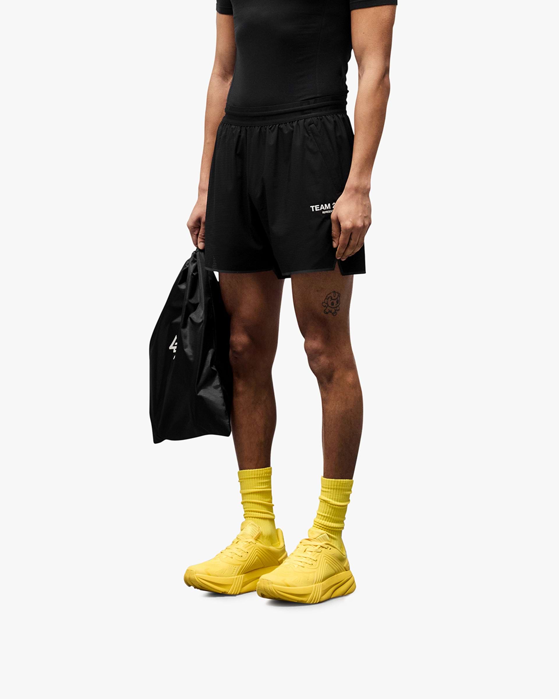 Back product image of a mens black short on a plain white background | Team 247 Aero Short in Black | Running shorts with branded waistband and zip pockets | 247 Shorts | Represent Clo
