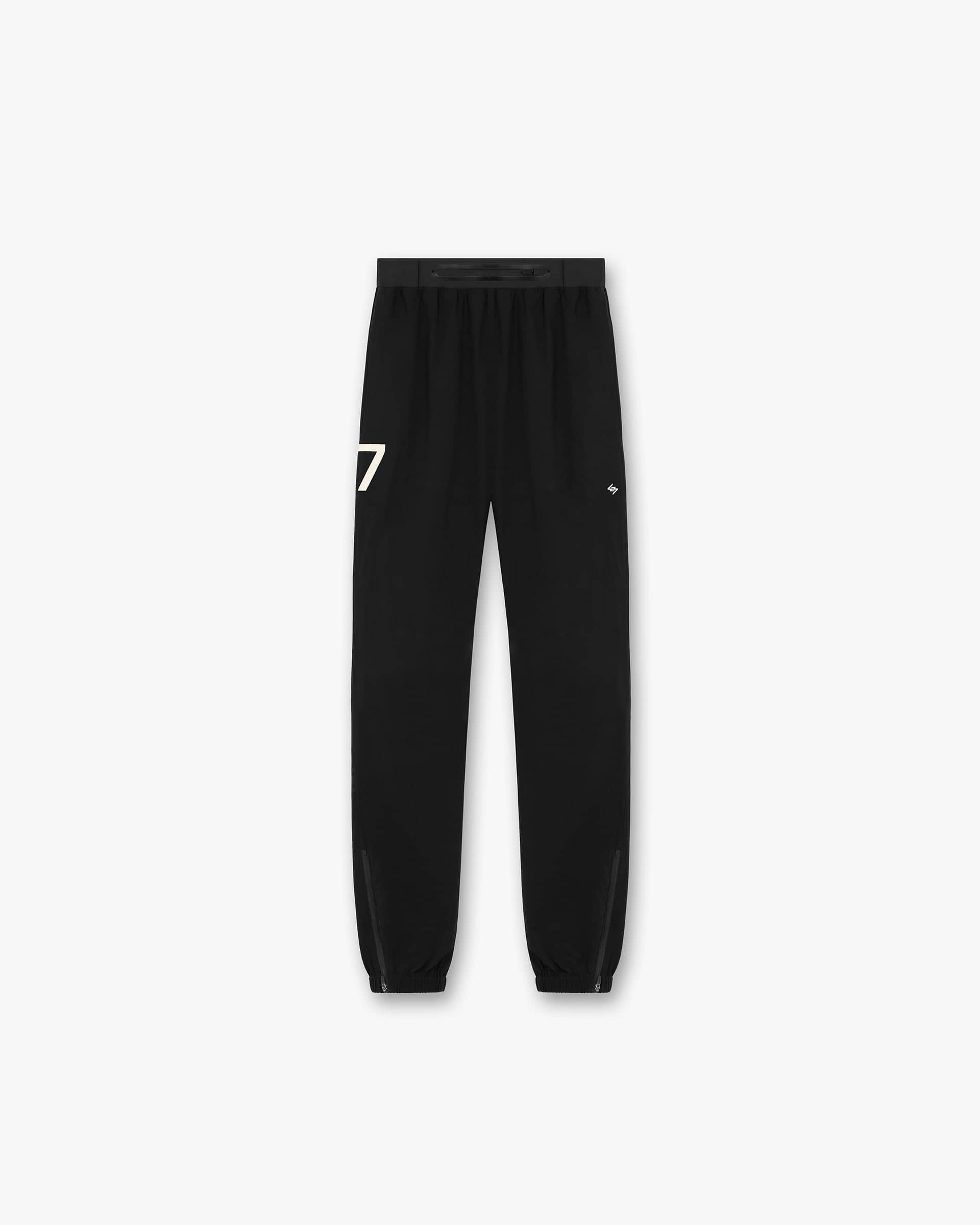 Back product image of mens black training pants on a plain white background | 247 Training Pant in Jet Black | Training pants with elasticated waistband and zip cuffs | 247 Pants | Represent Clo