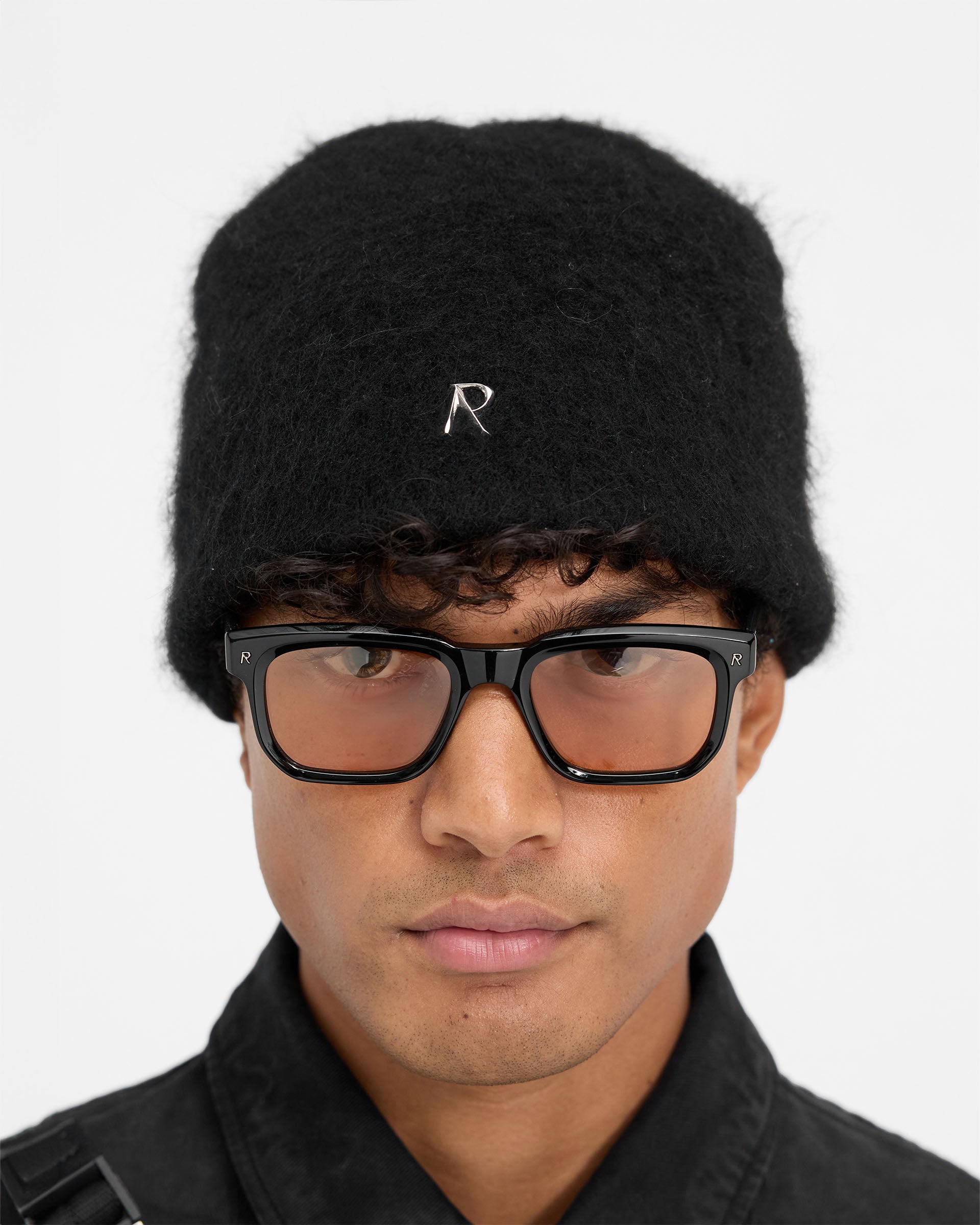 Back product image of a mens black beanie on a plain white background | Metal Initial Beanie in Jet Black | Black beanie with cotton lining and metal pin | FW24 Accessories | Represent Clo