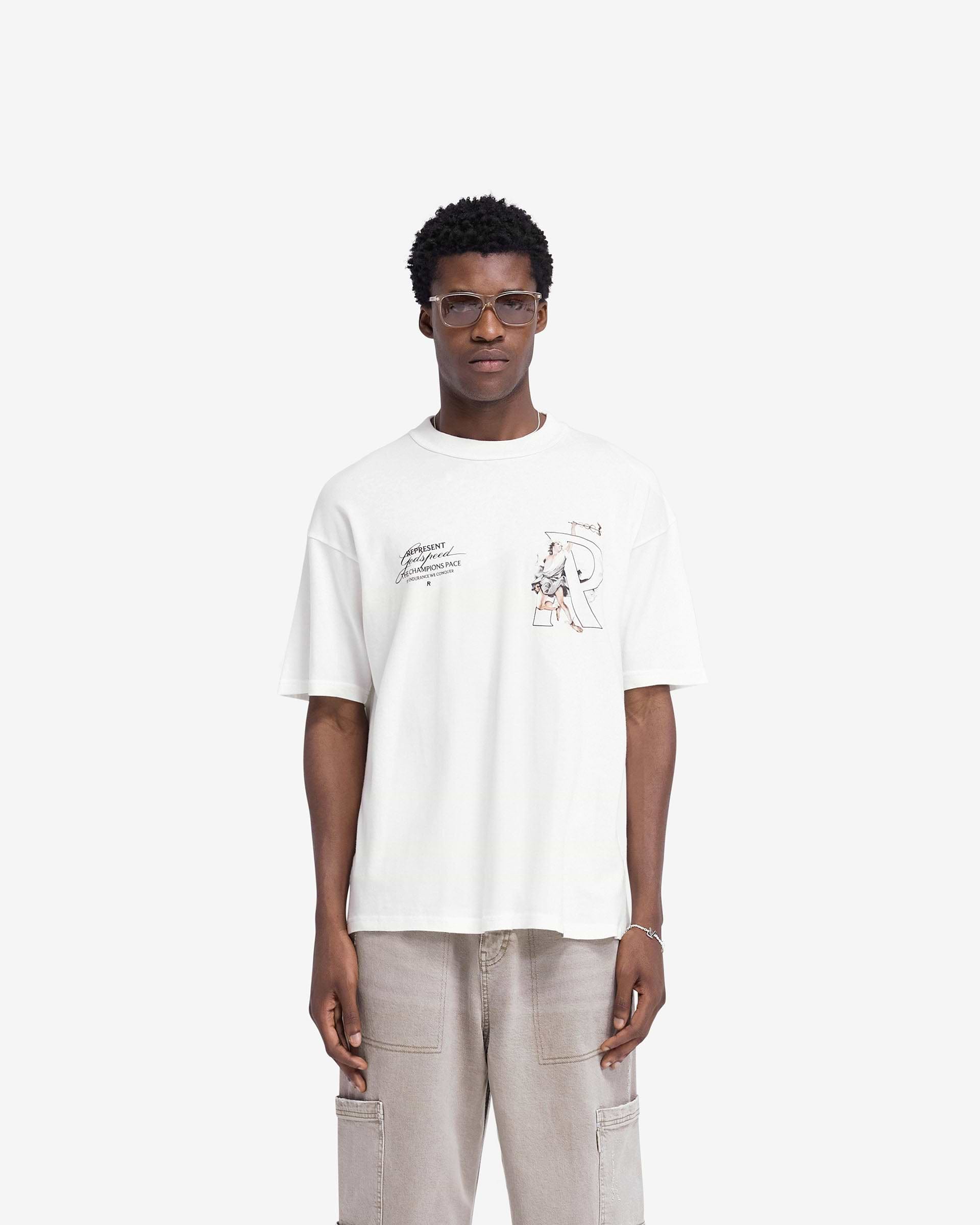 Man wearing an oversized white t-shirt on a plain white background | Hermes T-Shirt in Flat White | Oversized t-shirt with screen print graphic | FW24 T-Shirts | Represent Clo
