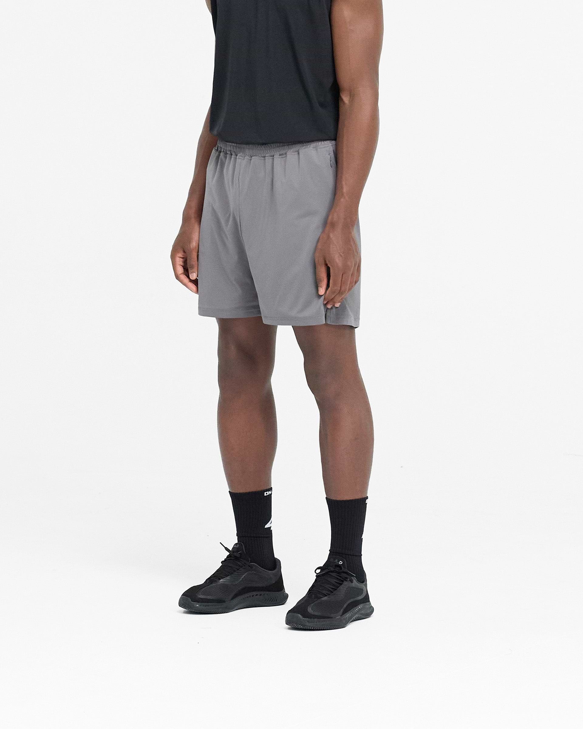 Back product image of mens grey shorts on a plain white background | 247 Mesh Shorts in Pewter | Oversized mesh shorts with zip pockets | 247 Shorts | Represent Clo