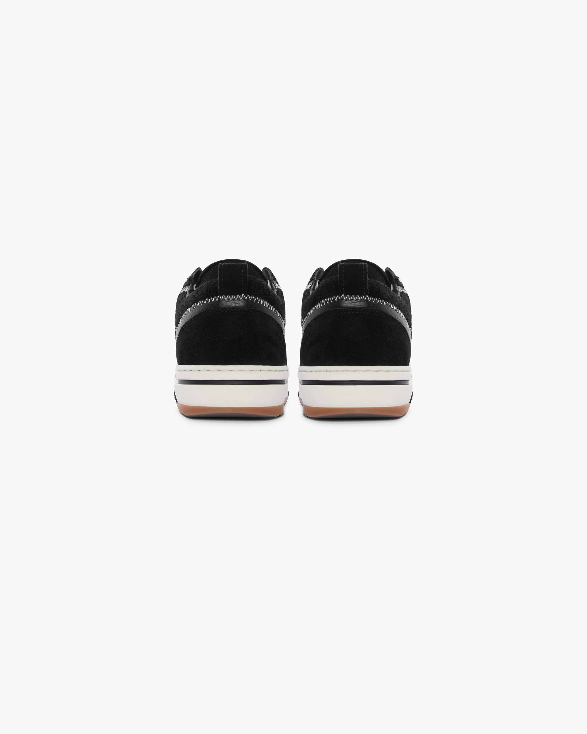 Product image of a mens black sneaker on a plain white background | HTN Low in Black | Low top sneakers with hairy suede uppers and leather trims | FW23 Footwear | Represent Clo