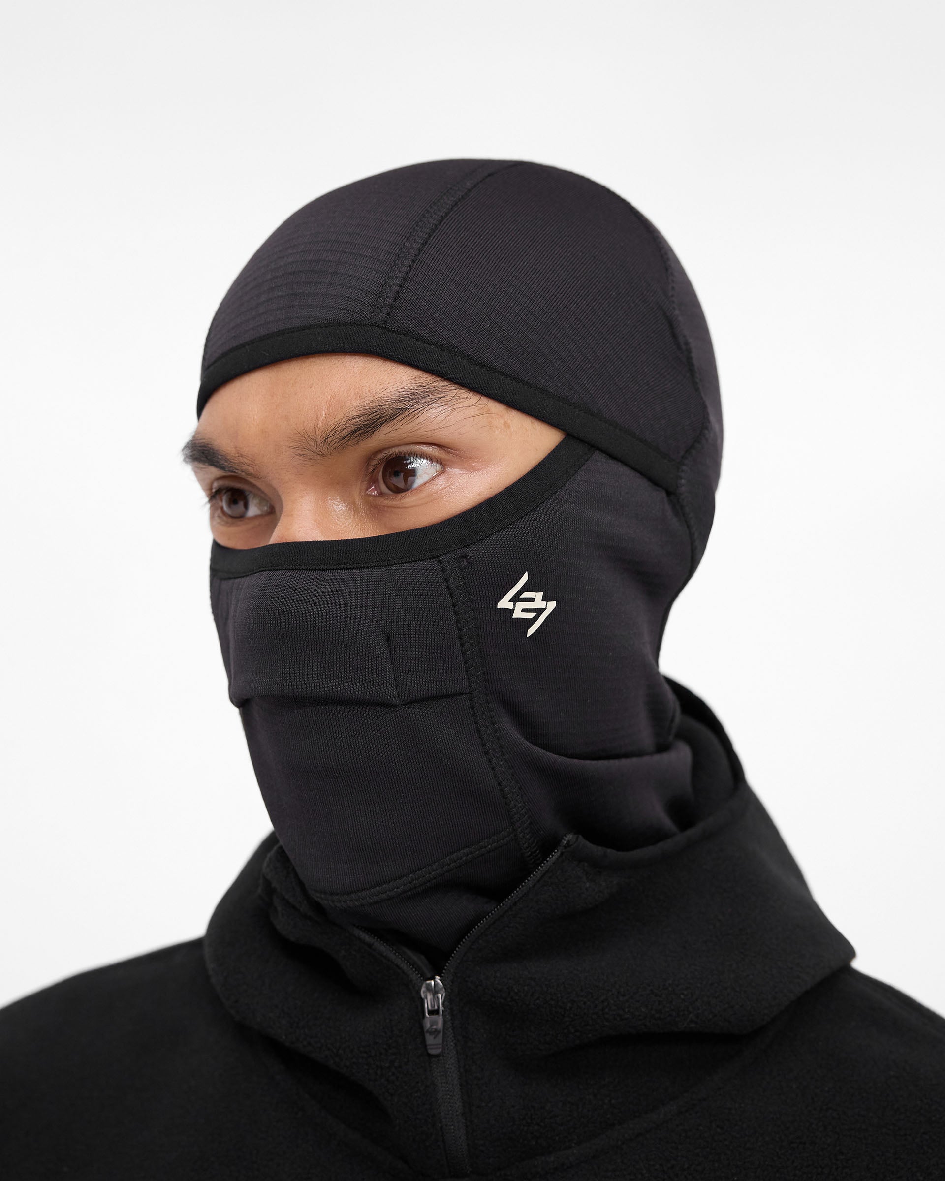 Back product image of a mens black balaclava on a plain white background | 247 Balaclava in Black | Gridded fleece with front ventilation and 247 branding | 247 Accessories | Represent Clo