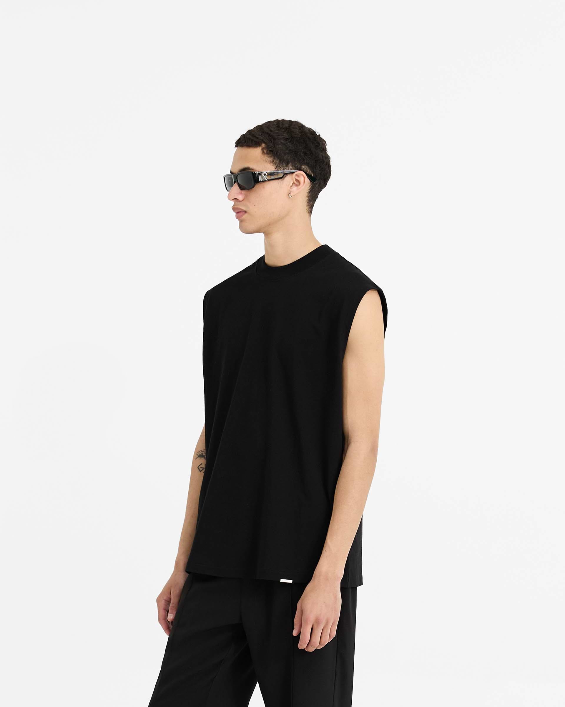 Back product image of a mens black tank on a plain white background | Initial Boxy Tank in Black | Oversized tank with boxy cropped fit | Initial T-Shirts | Represent Clo