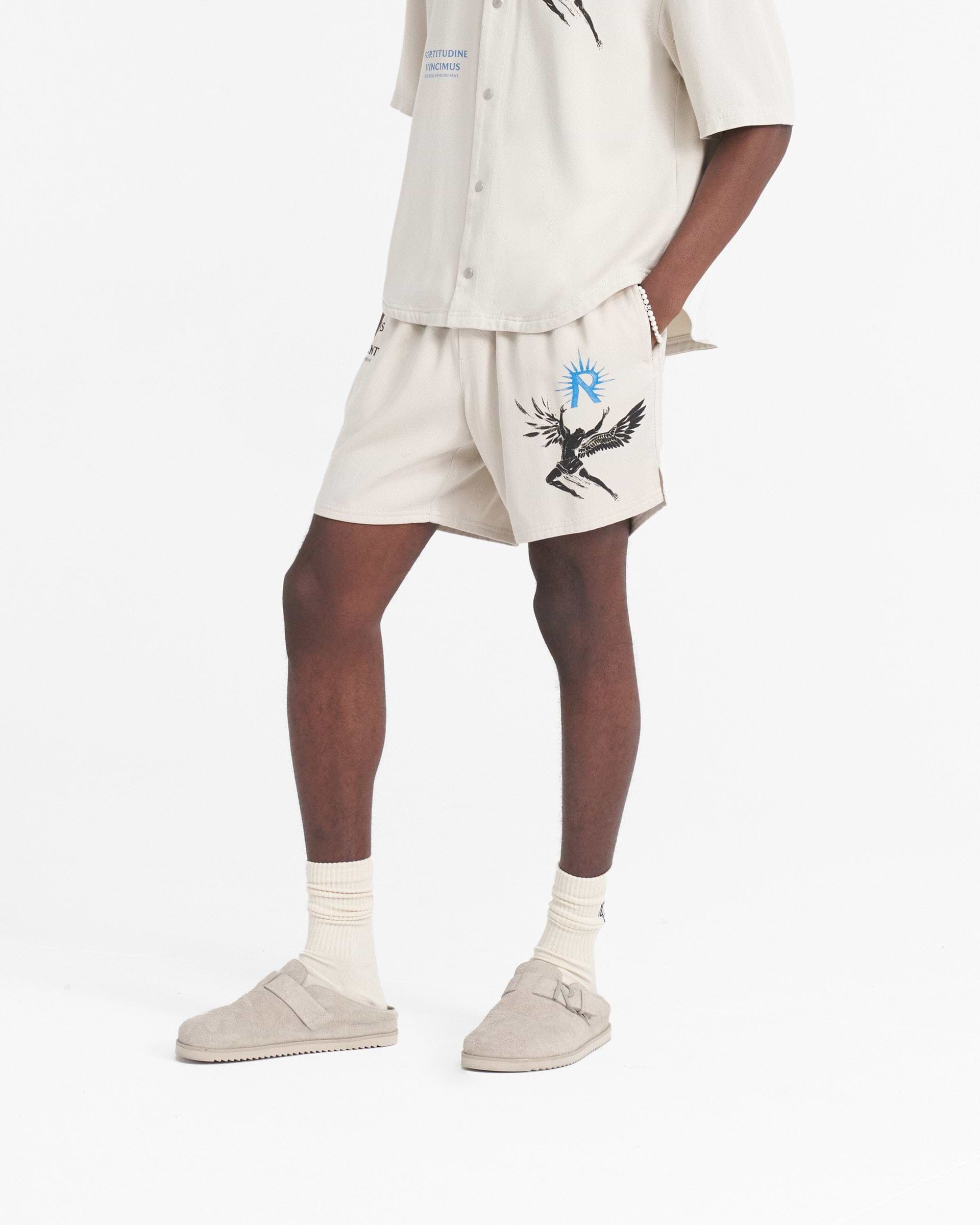 Back product image of mens off white shorts on a plain white background | Icarus Short in Off White | Shorts with elasticated waistband and Icarus artwork | SS24 Shorts | Represent Clo
