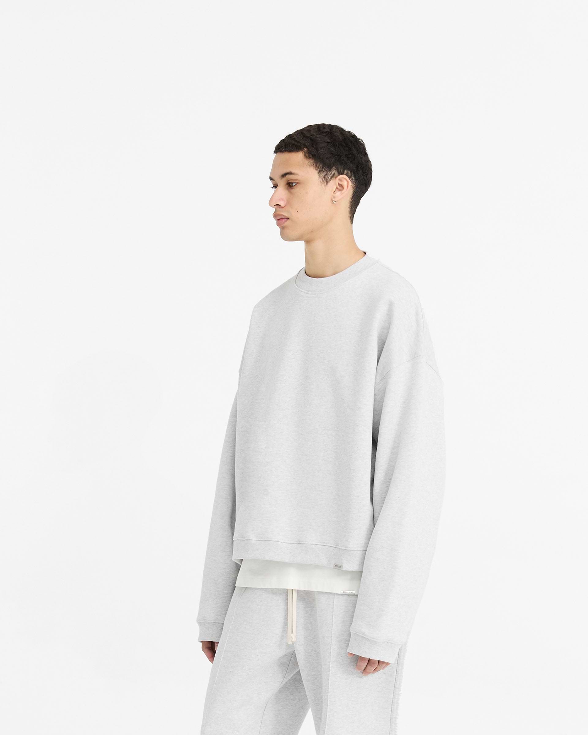 Back product image of a mens grey sweater on a plain white background | Initial Boxy Sweater in Ice Grey Marl | Heavyweight boxy fit sweater with dropped shoulders | Initial Sweaters | Represent Clo