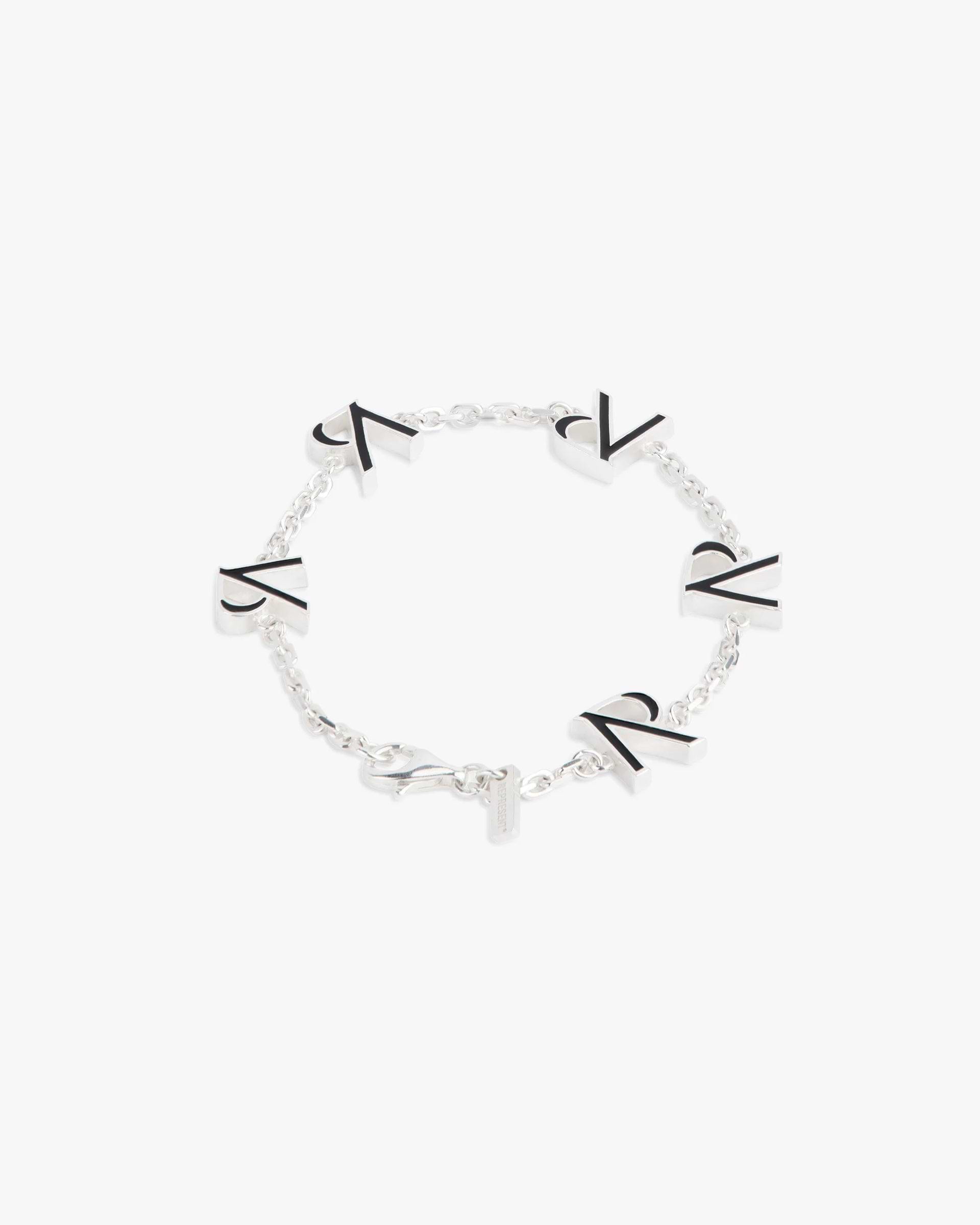 Front product image of a mens silver enamel bracelet on a plain white background | Represent Enamel Bracelet in Silver | Sleek accessory with polished finish | FW23 Accessories | Represent Clo