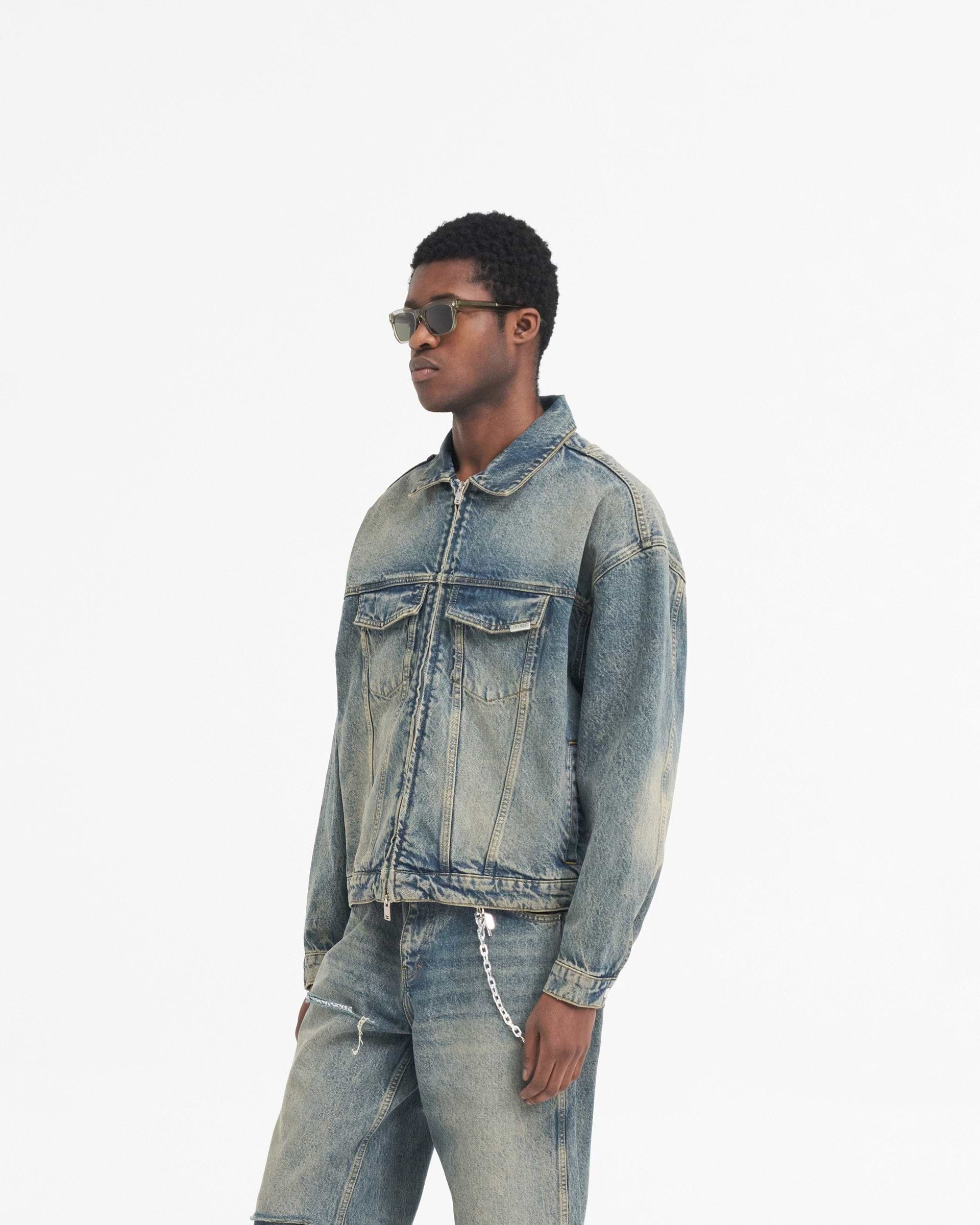 Back product image of a mens blue denim jacket on a plain white background | R4 Denim Jacket in Blue Cream | Slightly oversized denim jacket with RiRi zip closure | SS24 Denim | Represent Clo
