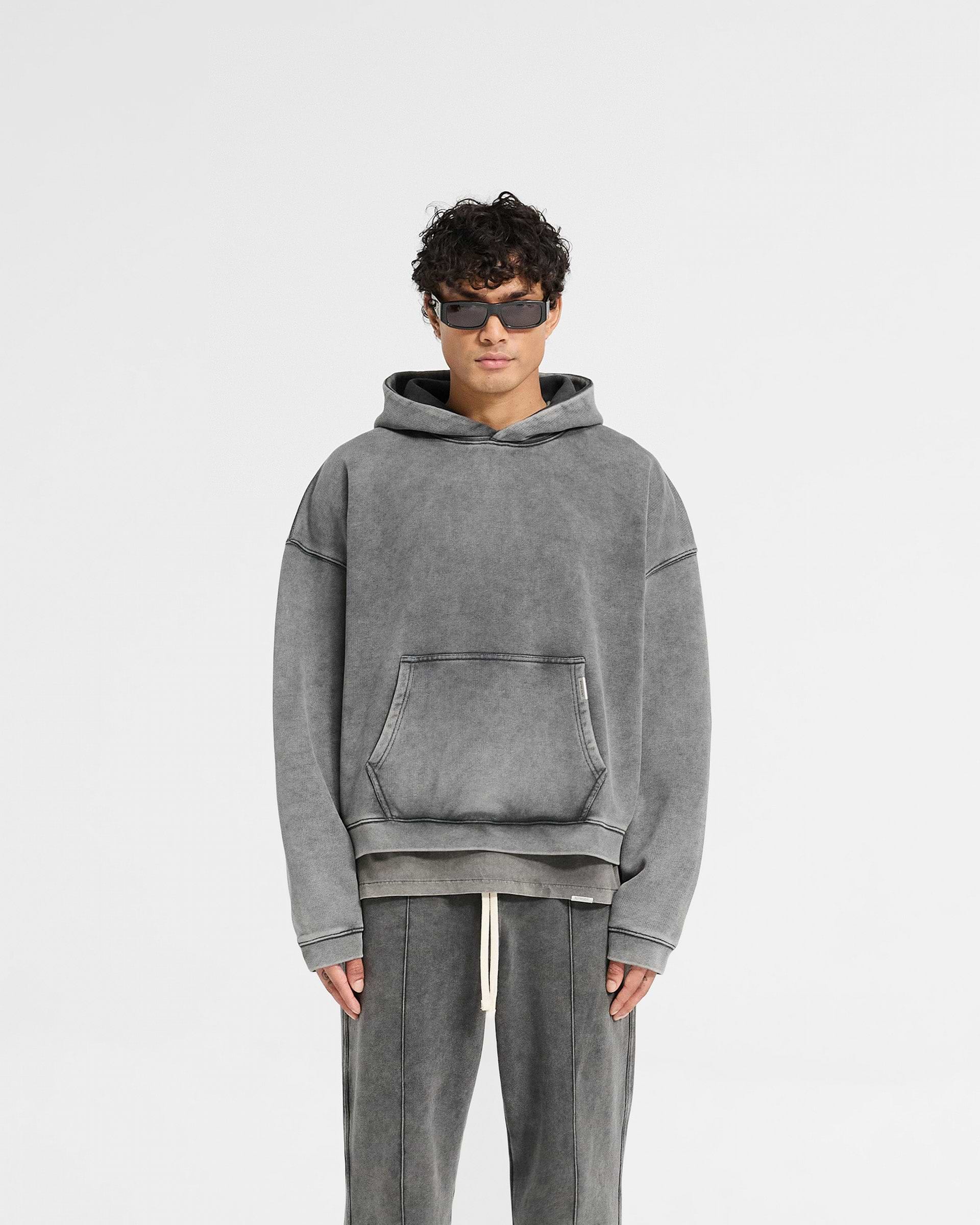 Man wearing an oversized grey hoodie on a plain white background | Initial Boxy Hoodie in Vintage Grey | Oversized boxy hoodie with cropped body and dropped shoulders | Initial Hoodies | Represent Clo