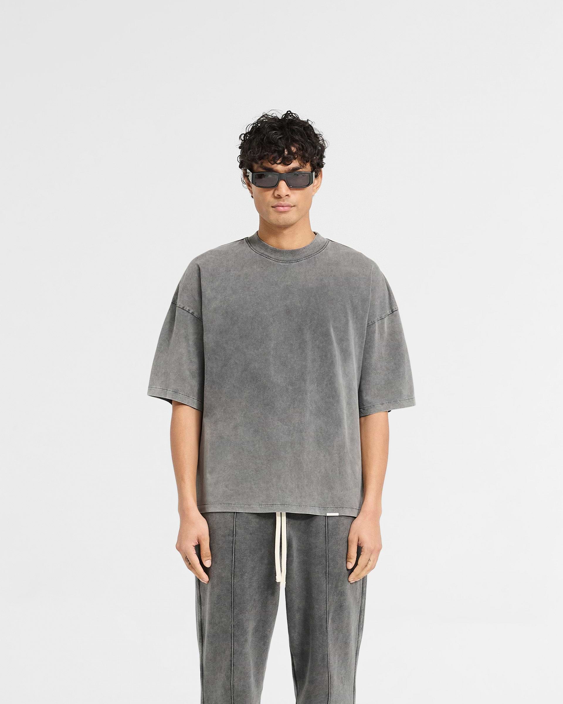 Man wearing a grey boxy t-shirt on a plain white background | Initial Boxy T-Shirt in Vintage Grey | Super oversized cropped fit t-shirt | Initial T-Shirts | Represent Clo