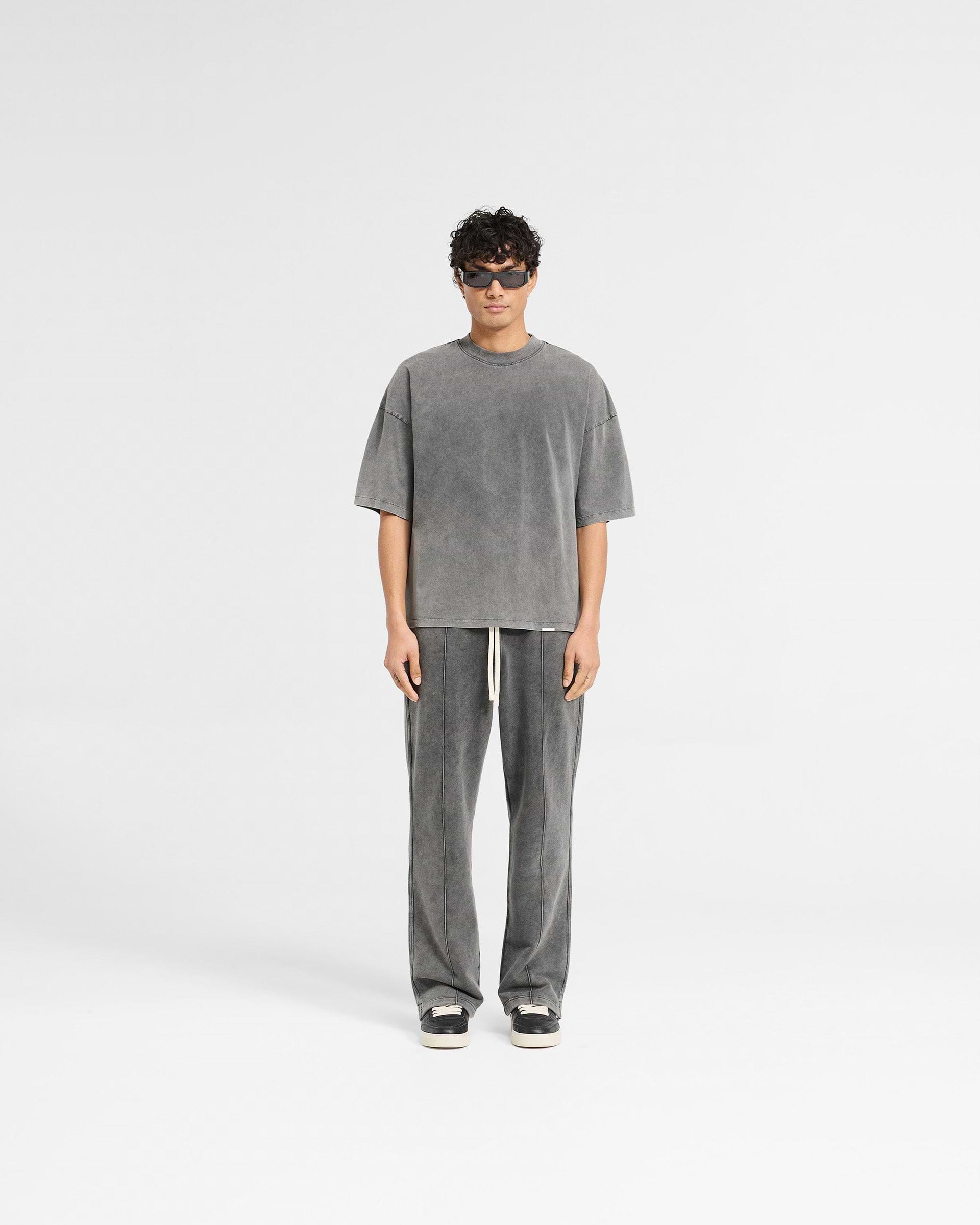 Man wearing a grey boxy t-shirt on a plain white background | Initial Boxy T-Shirt in Vintage Grey | Super oversized cropped t-shirt | Initial T-Shirts | Represent Clo