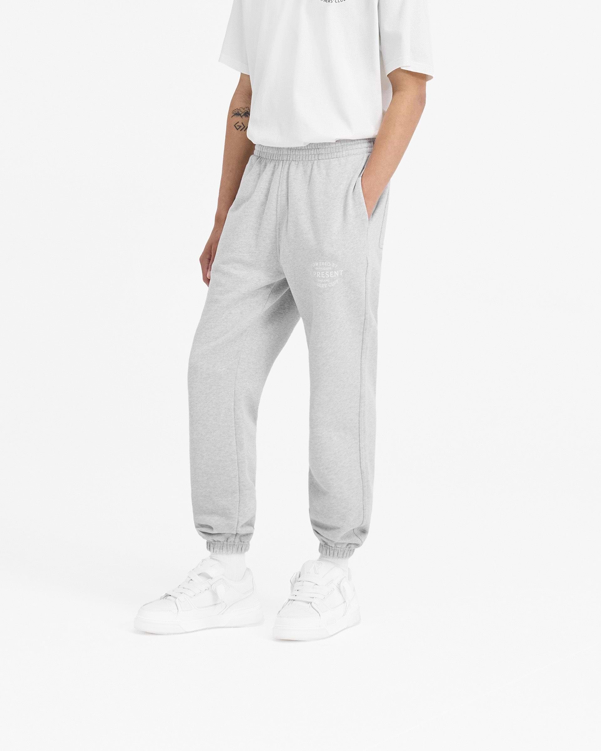 Back product image of mens grey sweatpants on a plain white background | Represent Owners Club Stamp Sweatpant in Ash Grey | Sweatpants with elasticated cuffs and waistband | Owners Club Pants | Represent Clo