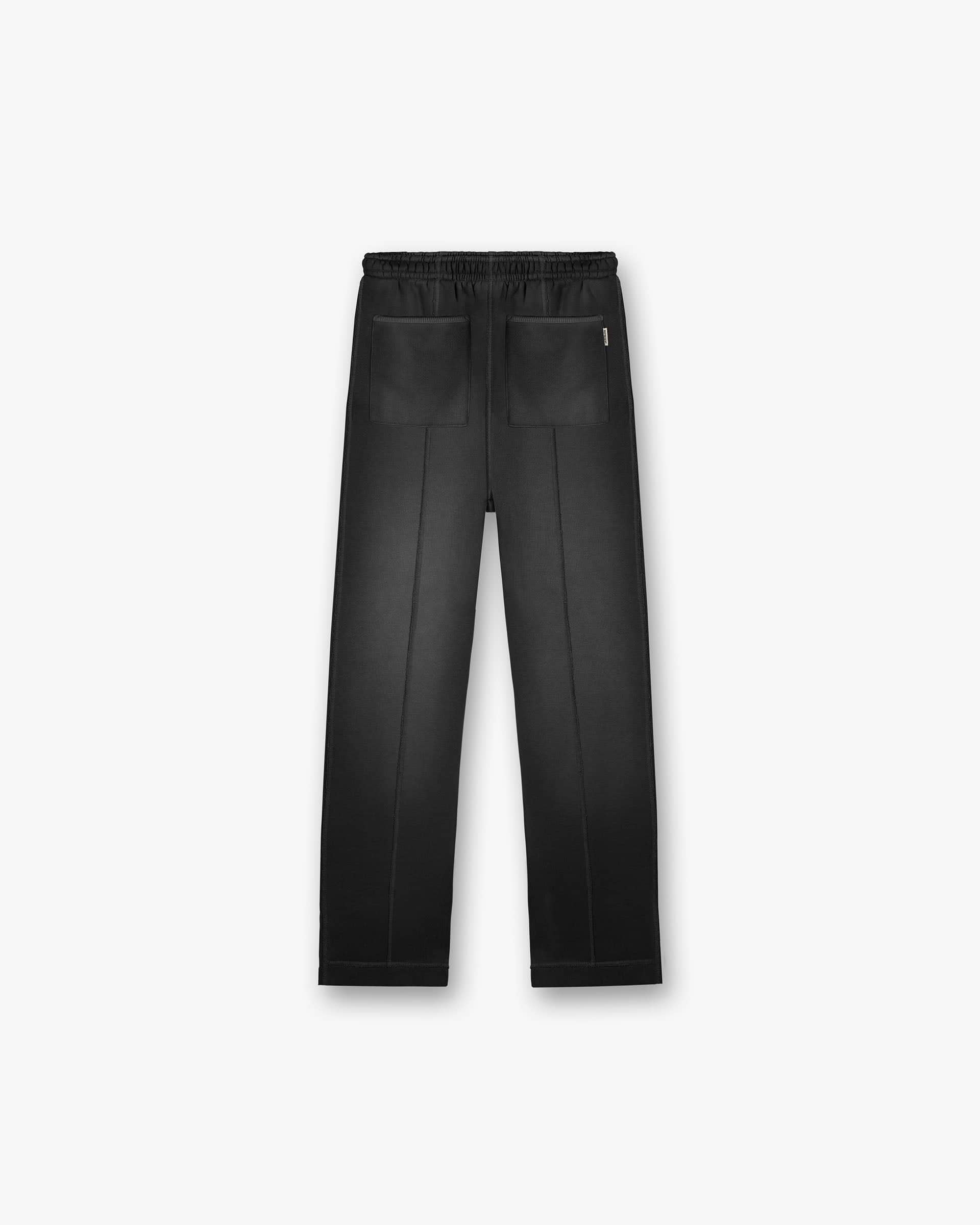 Back product image of mens black sweatpants on a plain white background | Stepped Hem Sweatpants in Stained Black | Wide leg sweatpants with faded wash and stepped hem | FW24 Pants | Represent Clo