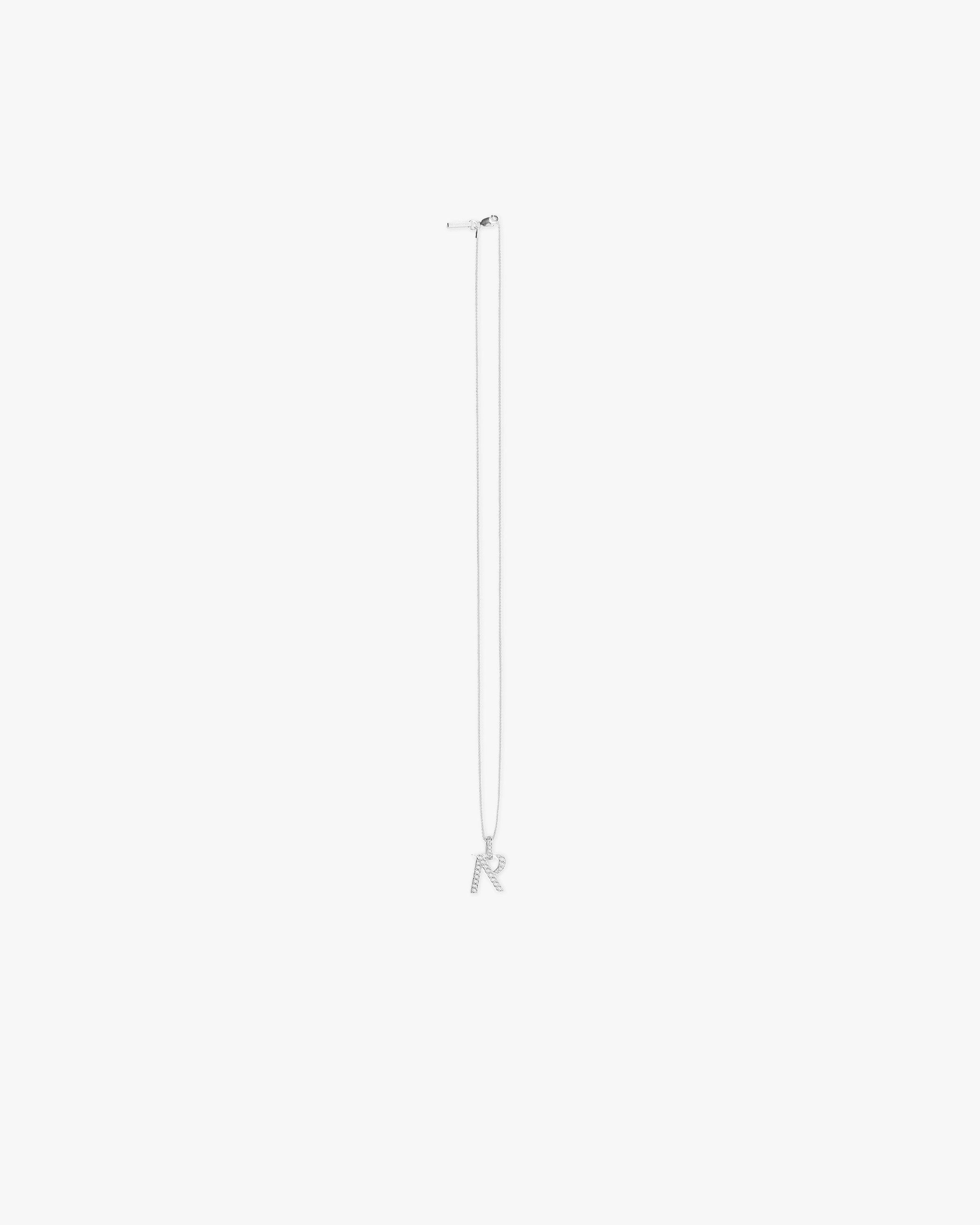 Front product image of a mens silver pendant on a plain white background | Pavé R Pendant in Silver | Silver pendant accessory with luxury design | FW23 Accessories | Represent Clo