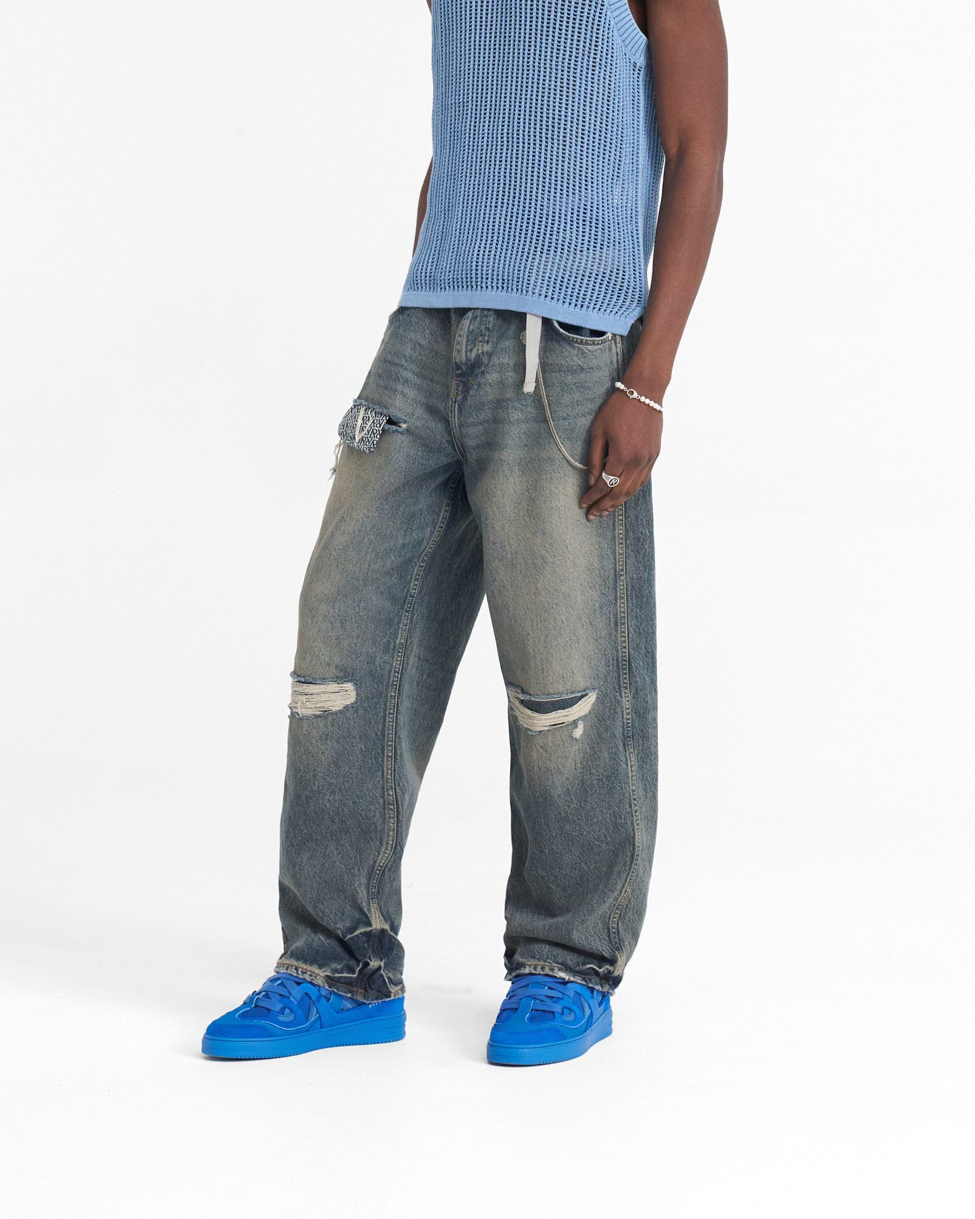 Back product image of mens blue denim jeans on a plain white background | R3D Destroyer Baggy Denim in Blue Cream | Baggy fit ripped denim with monogram pocket | SS24 Denim | Represent Clo