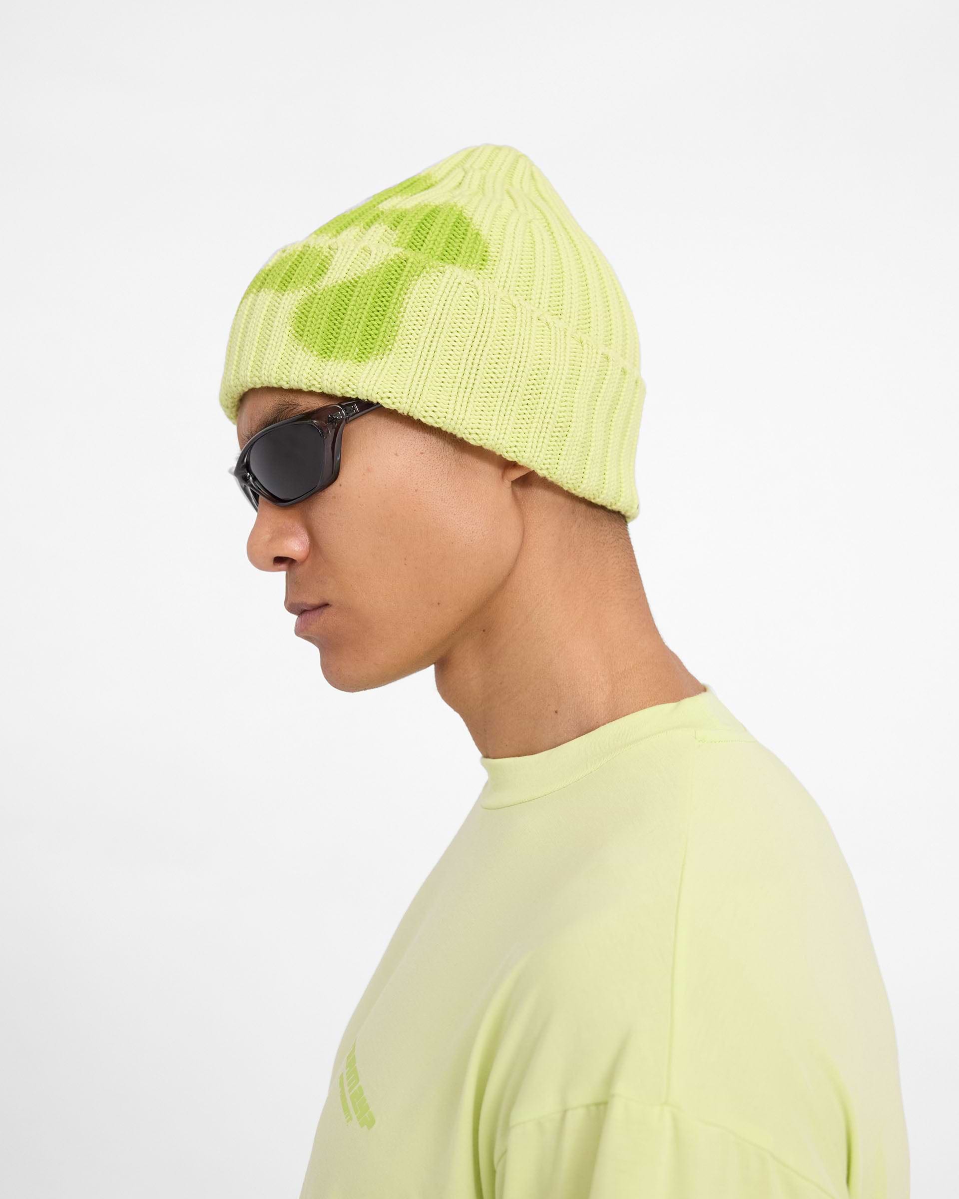 Back product image of a mens green beanie on a plain white background | 247 Heavy Rib Beanie in Shadow Lime | Cotton beanie with abstract logo | 247 Accessories | Represent Clo