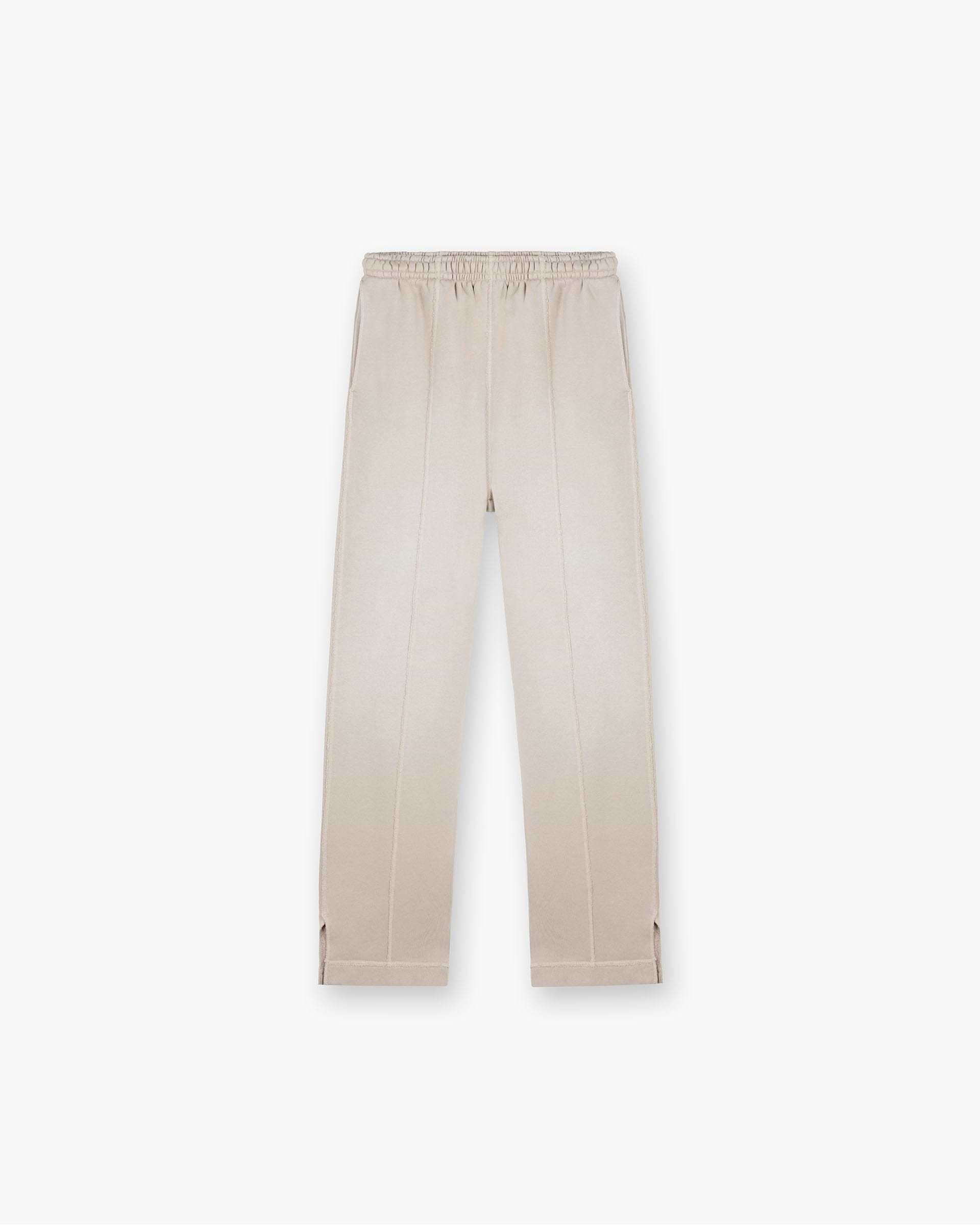Front product image of mens oat sweatpants on a plain white background | Stepped Hem Sweatpants in Oat | Oversized fit sweatpants with stepped hems | FW24 Pants | Represent Clo