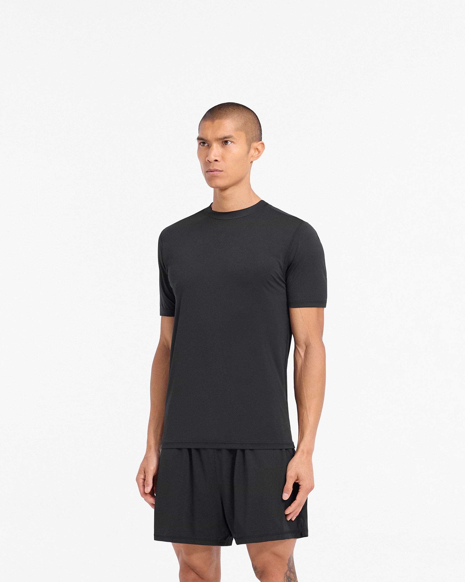 Man wearing a black t-shirt on a plain white background | 247 DNA Mesh T-Shirt in Black | Lightweight breathable mesh t-shirt | 247 T-Shirts | Represent Clo