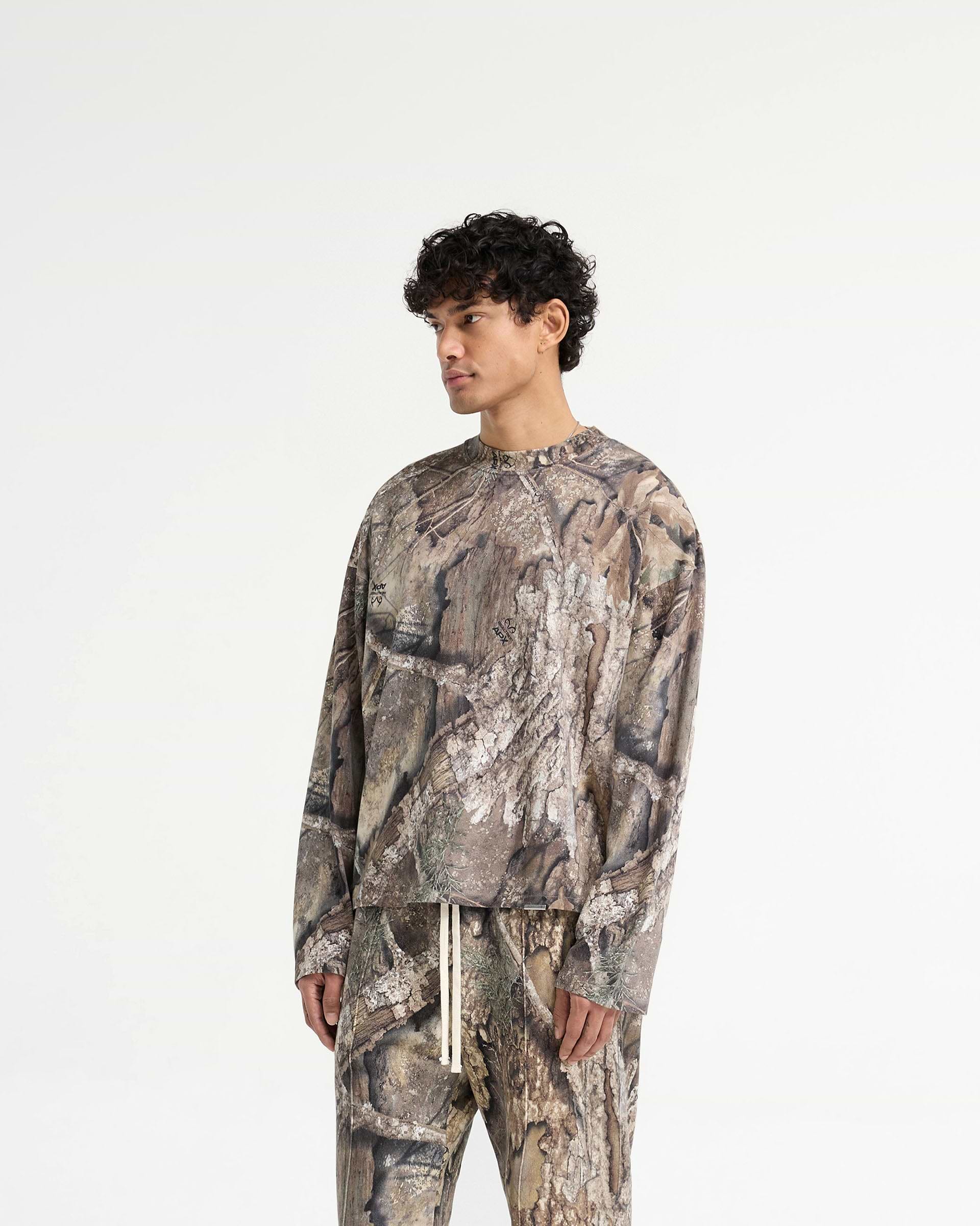 Back product image of a mens camo long sleeve t-shirt on a plain white background | Realtree Camo Long Sleeve T-Shirt in Camo | Medium weight jersey cotton long sleeve t-shirt with carbon finish | SS25 T-Shirts | Represent Clo