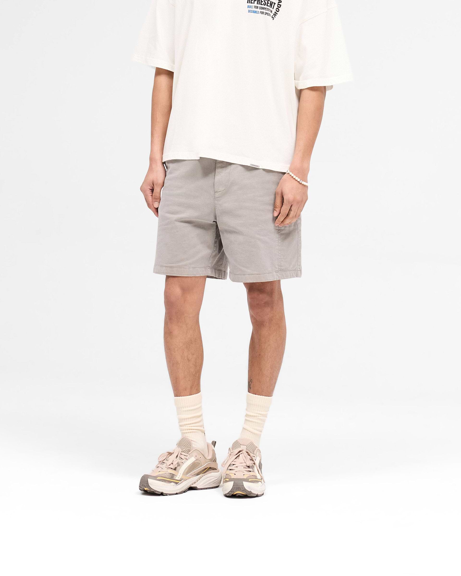Back product image of mens taupe shorts on a plain white background | Season Cargo Short in Washed Taupe | Cargo shorts with welt pockets and YKK fly | SS25 Shorts | Represent Clo