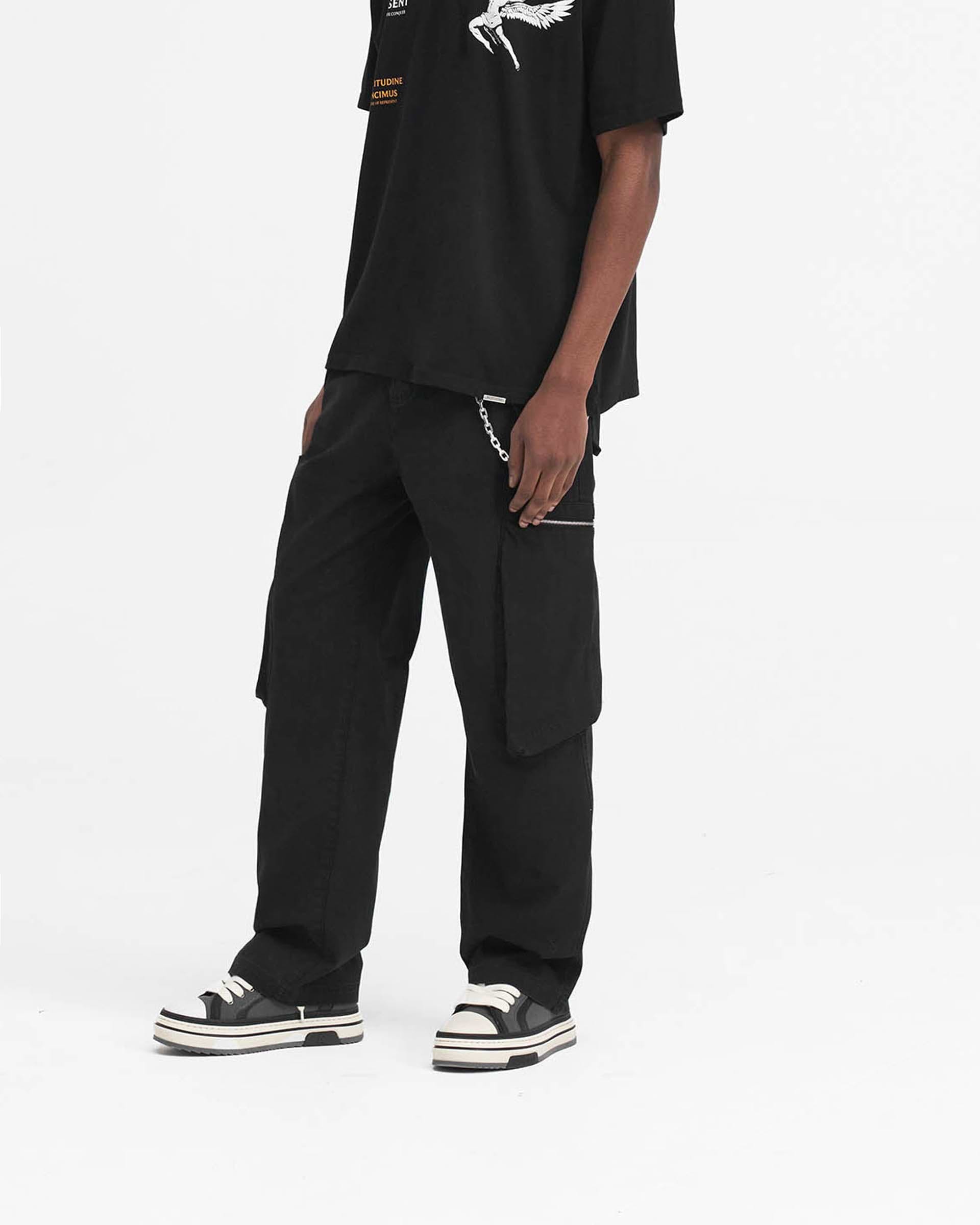 Back product image of mens black pants on a plain white background | Workshop Pant in Black | Oversized fit pants with asymmetric thigh pockets | SS24 Pants | Represent Clo
